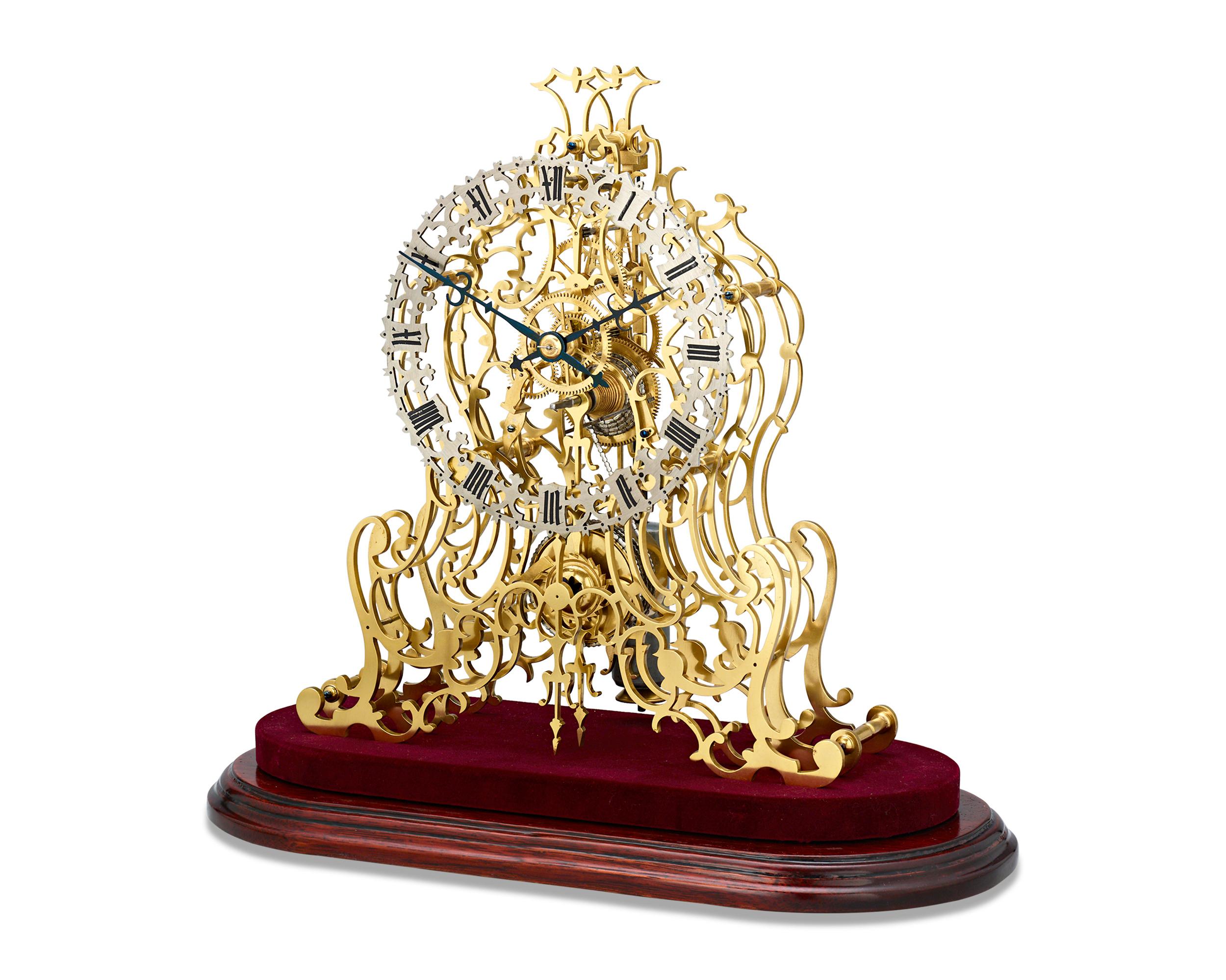 This incredible arabesque skeleton clock is a stellar example by the preeminent English firm of William Frederick Evans of Handsworth, Birmingham. This horologic masterpiece is in complete, working condition, boasting an amazing brass triple-layer