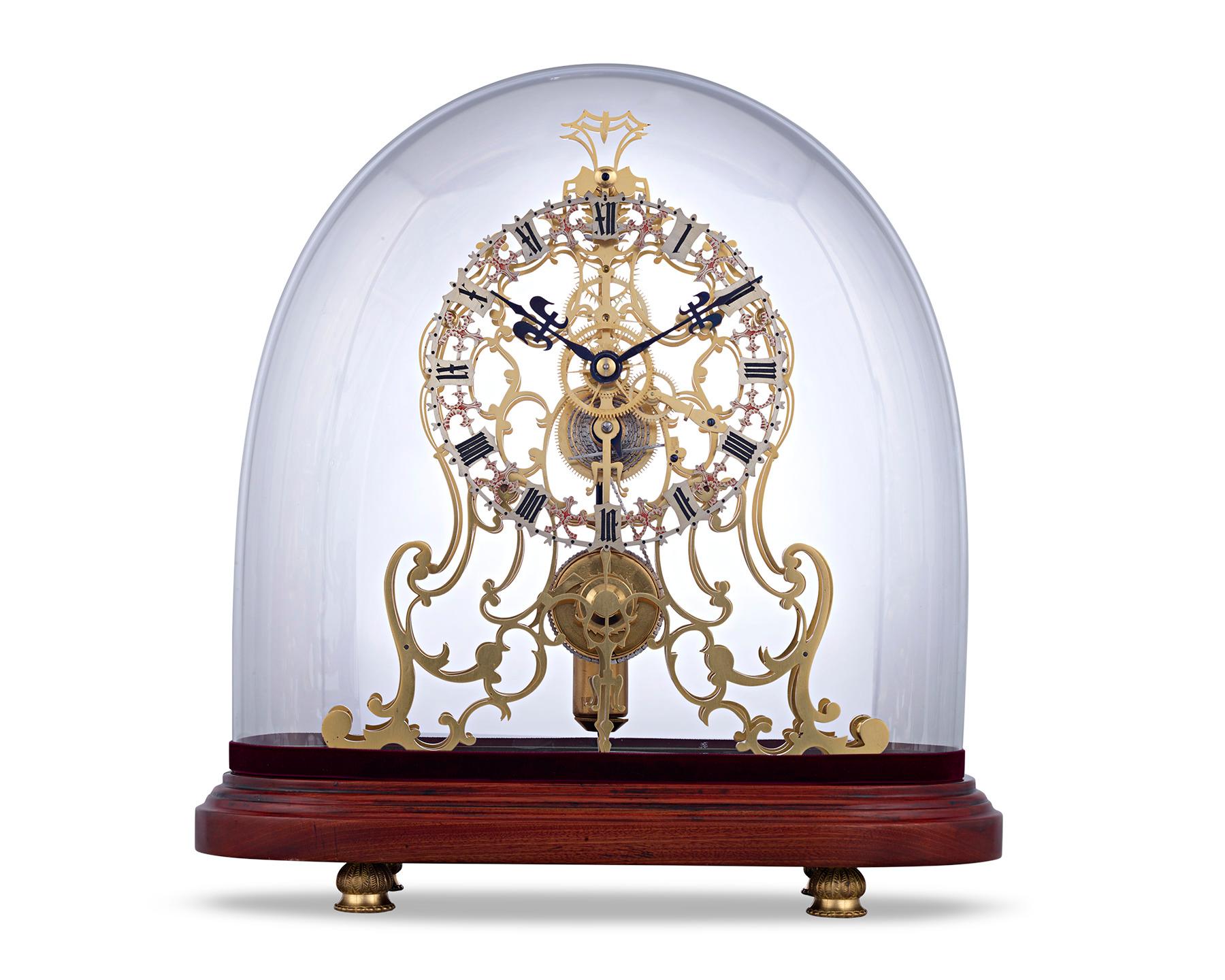 This exceptional arabesque skeleton clock is a stellar example of English clockmaking from the preeminent English firm of Evans of Handsworth. The complex timepiece incorporates both an unusual, oversized dial and a complex 8-day triple plate