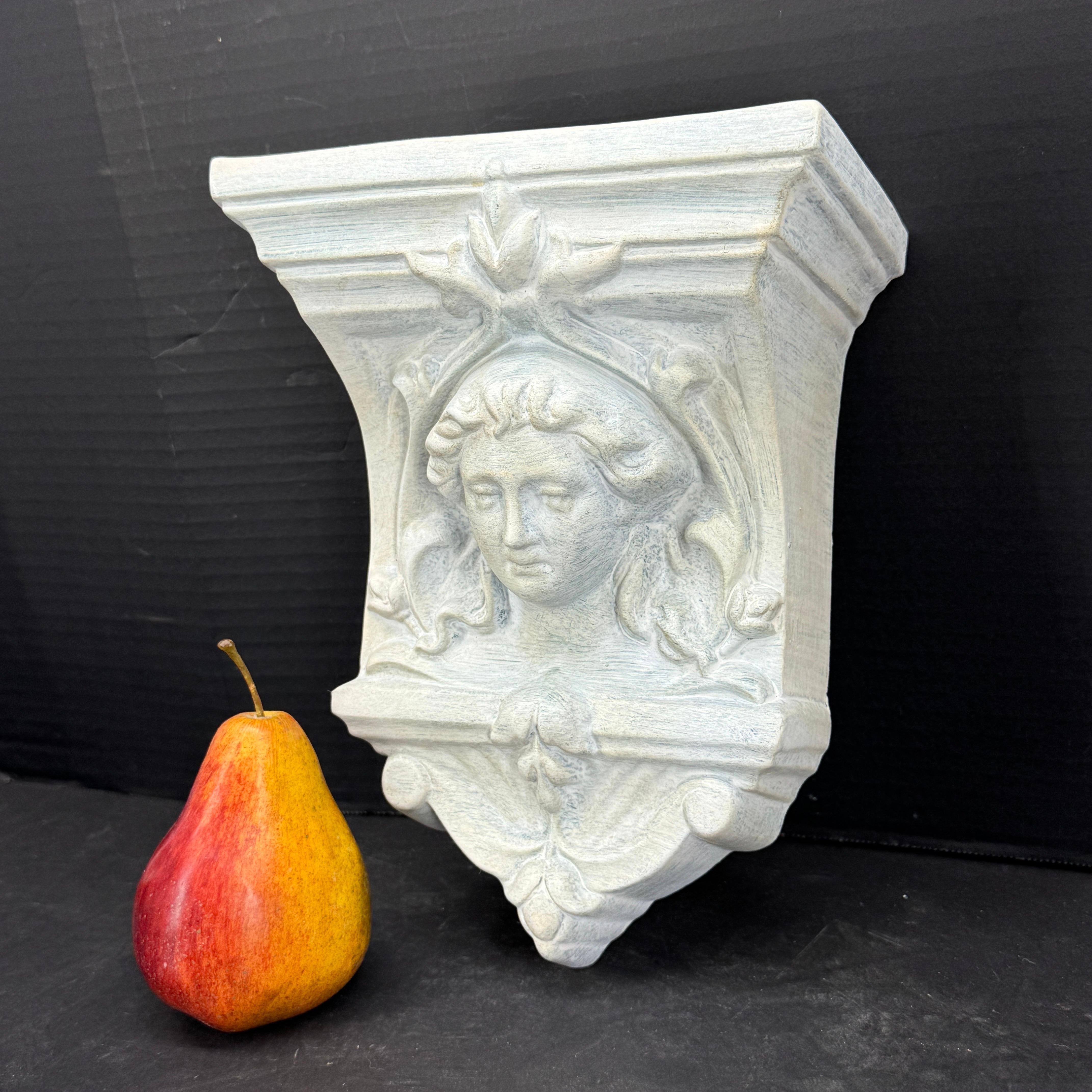 This painted wall pocket or sculpture is beautifully constructed and ornamented with an English Woman in the center. This piece would be a wonderful architectural element standing alone or on any wall or part of a gallery wall. Marked 