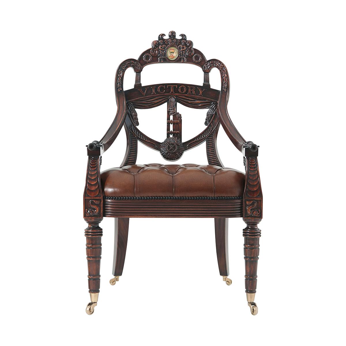 An exceptionally well hand-carved mahogany library armchair, the back in the shape of a ship's transom carved with a Coat of Arms centered by the Spencer crest and flanked by Victory wreaths. Inspired by a Regency original.

Dimensions: 27.25