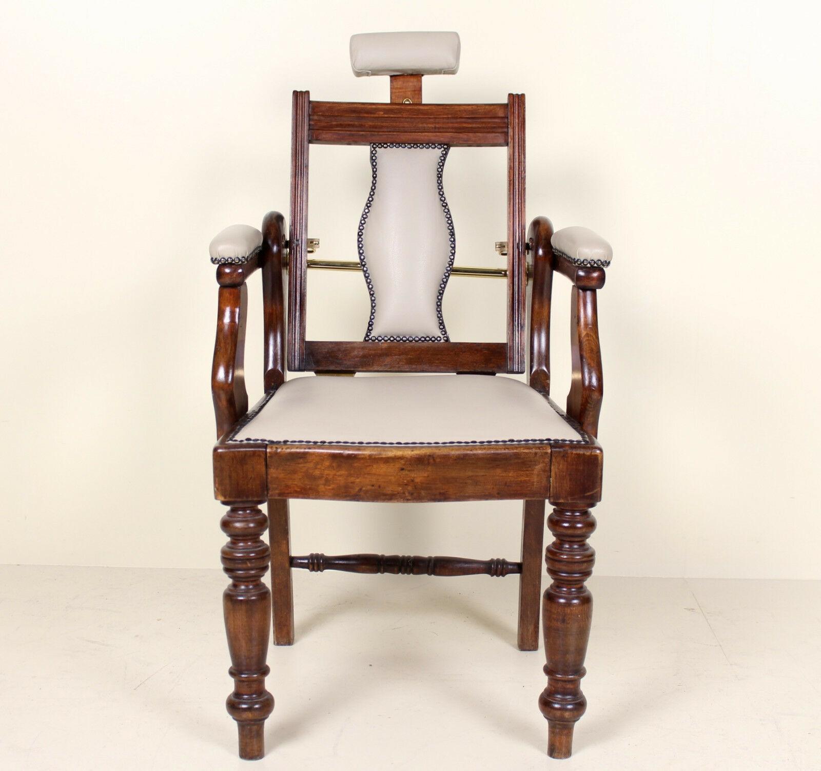 A rare opportunity to acquire an impressive Edwardian period (circa 1905) barbers chair. Framed in carved mahogany, with newly upholstered leather or leather cloth panels with studded brass borders. Raised on carved fluted turned legs.
  