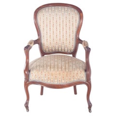 Fauteuil anglais tapissé de tissu avec fleurs