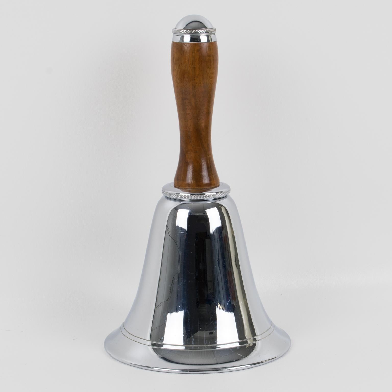 This is a stunning Art Deco wood and chrome cocktail or Martini shaker designed in England circa 1930. Streamline Art Deco design, this barware piece is shaped like a bell and has two fine lines etched around the bottom of the flared dome. The