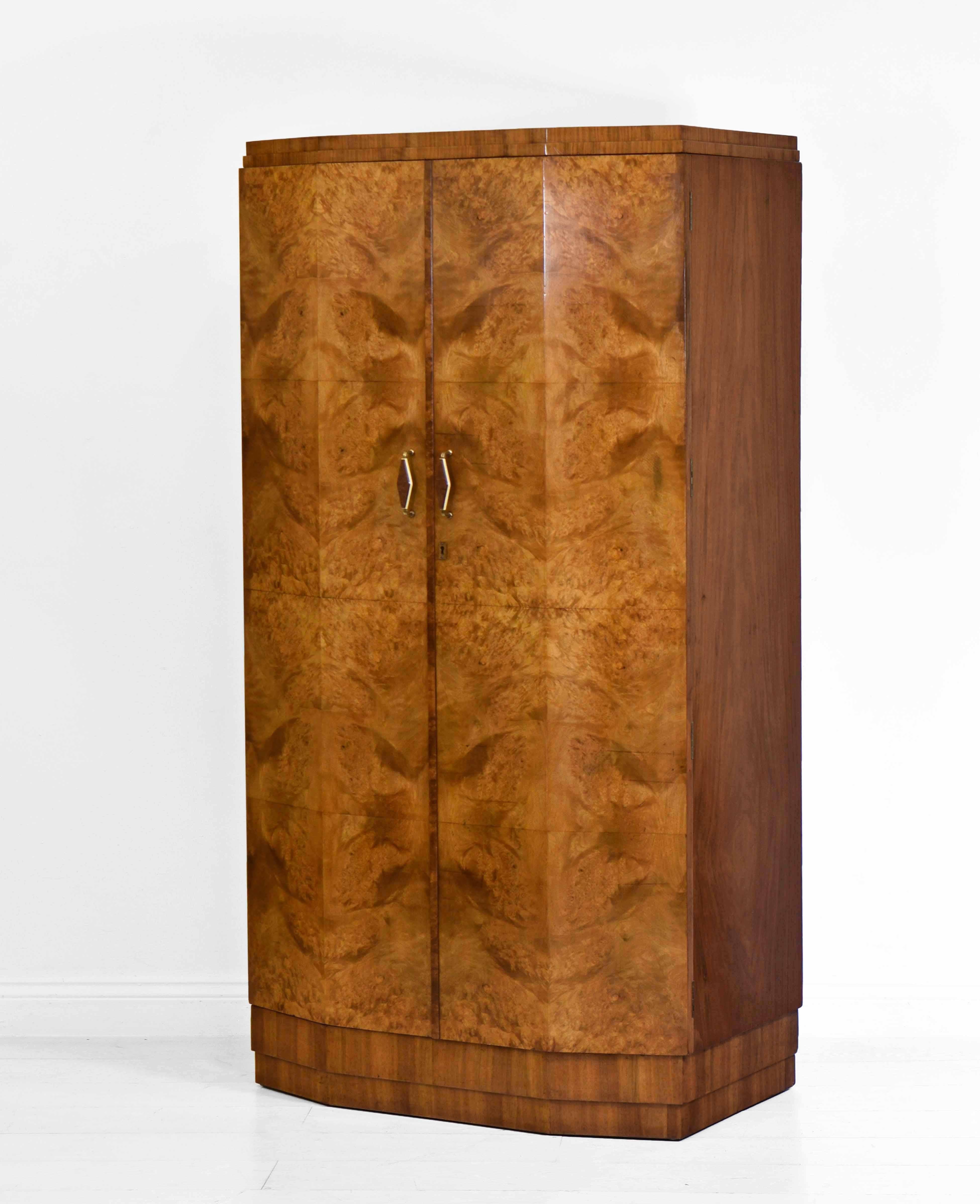 Superb Art Deco burr and figured walnut canted design gentlemen's compactum on stepped plinth. Circa 1930.

*Free delivery for all areas in mainland England & Wales only. Delivery to room of choice with good access by a two person team. Items are
