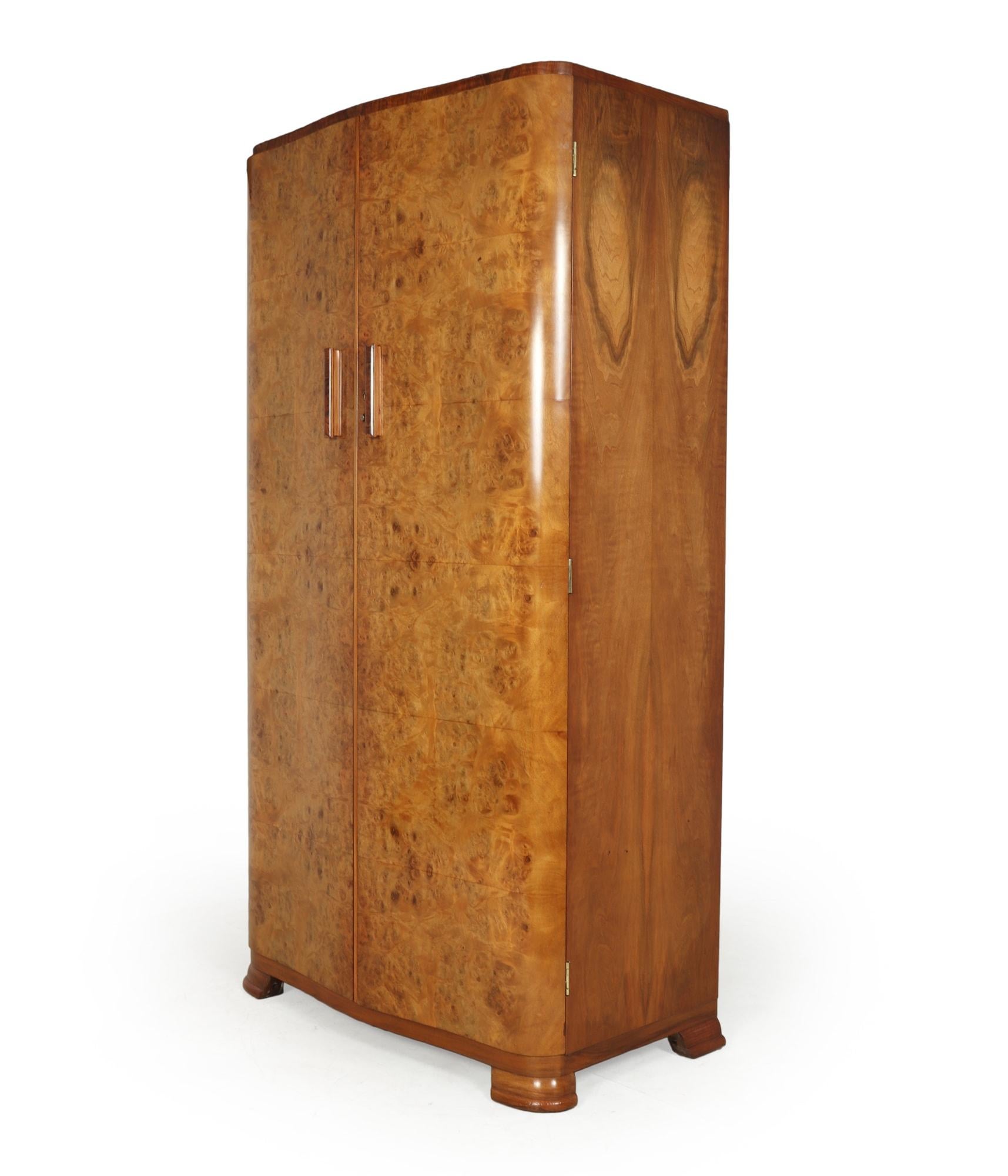 A serpentine fronted gentleman’s fitted wardrobe solid wood handles standing on bracket feet the wardrobe is very good quality with a fully fitted interior. The wardrobe has been restored where necessary and fully hand polished

Age: