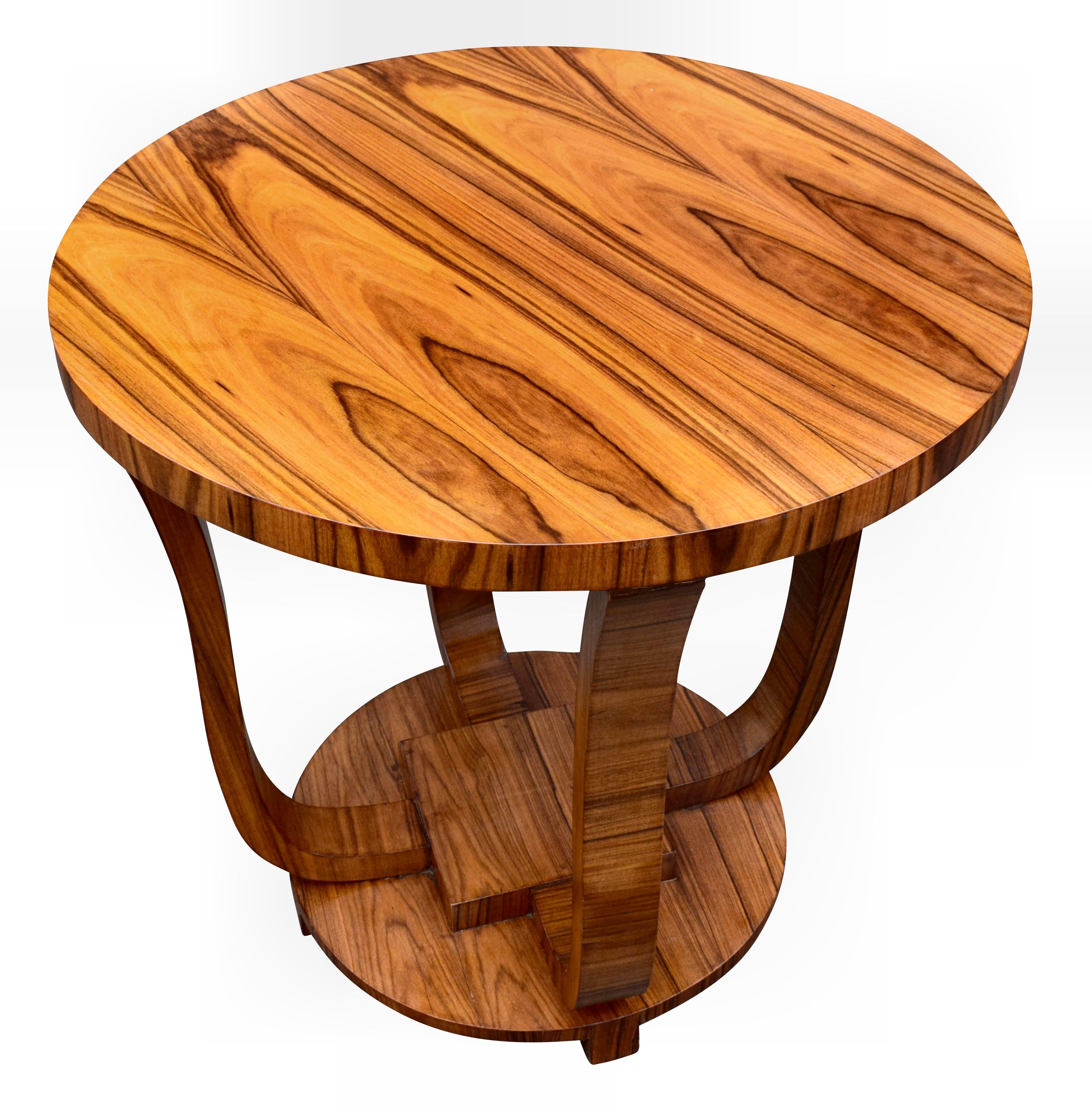 Very stylish and totally authentic English Art Deco walnut centre table dating to the 1930s. This table is beautifully shaped and fully restored to showroom condition. Typically larger than occasional coffee tables, these make ideal pieces to make a