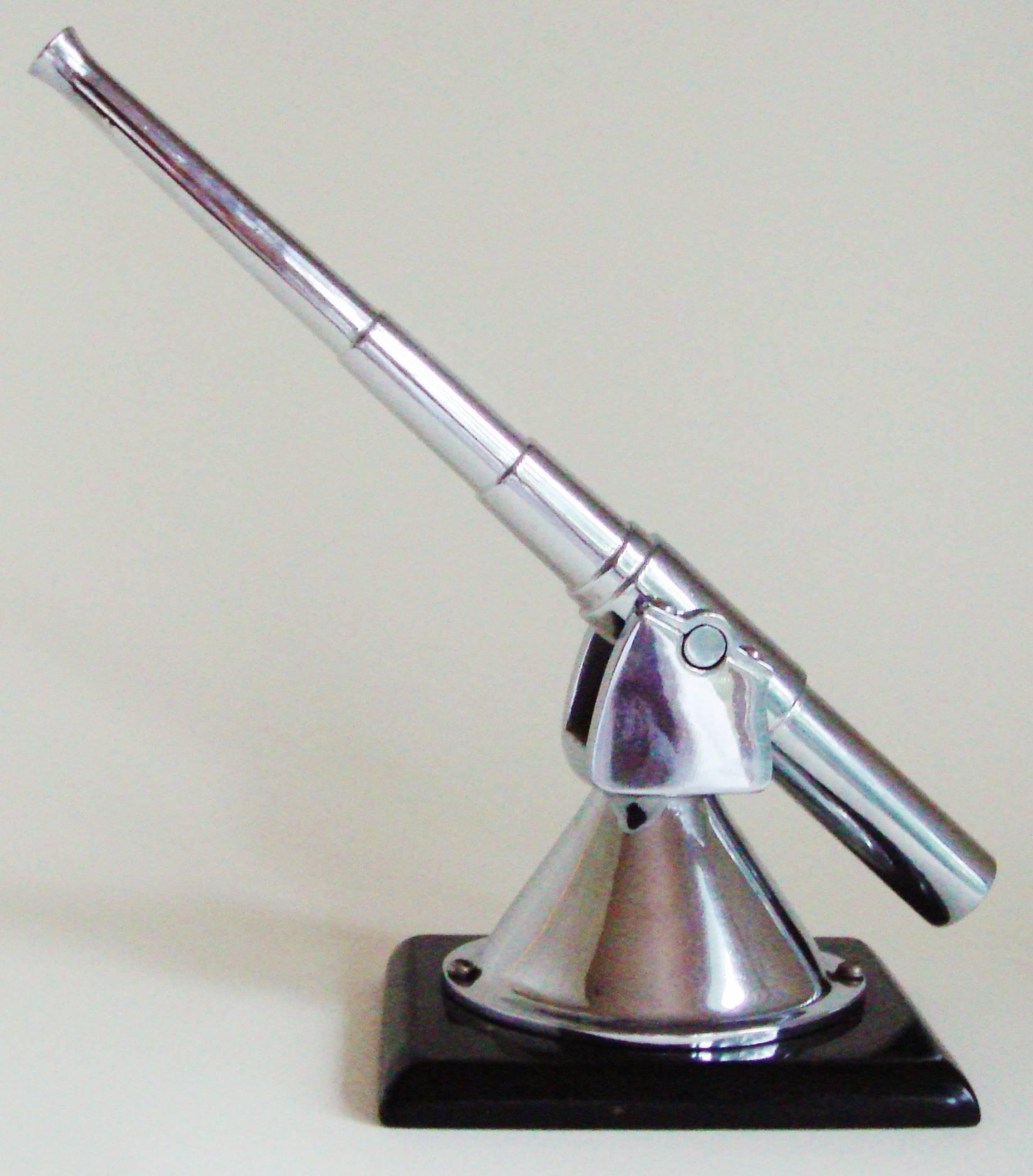 This very elegant English Art Deco styled desk model/paperweight of a WWII deck mounted anti-aircraft gun would seem to be loosely based on the Bofors 40mm. It is beautifully made in chrome plated steel and even includes the Bofors' signature flared