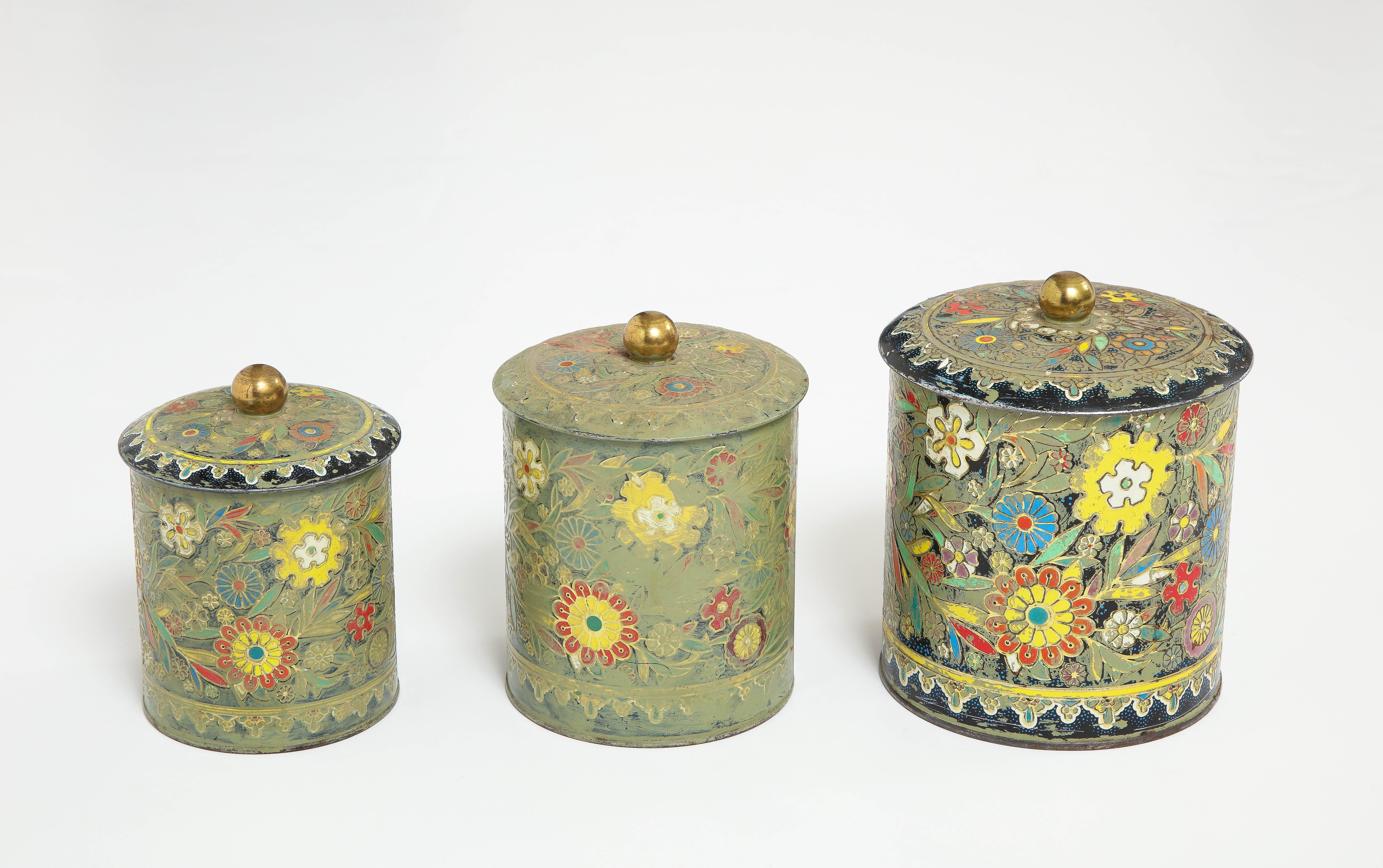 Set of 3 Art Deco cannisters with an enameled floral pattern.