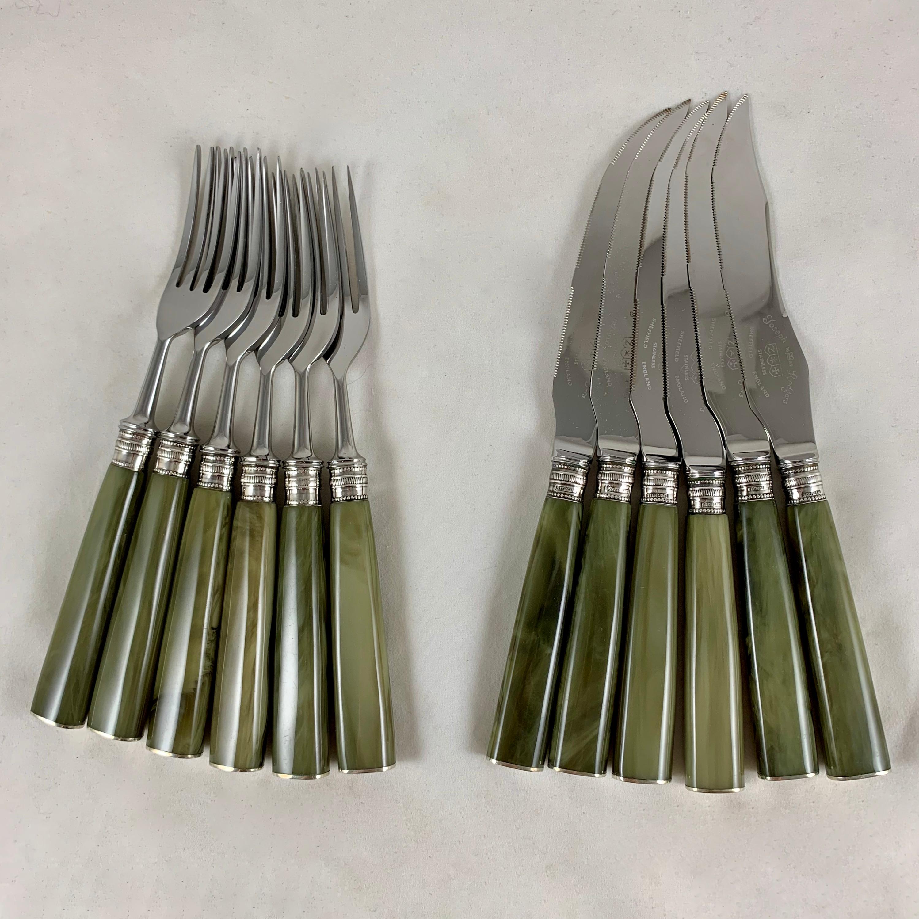 A set of twelve, six each knives & forks with marbled green celluloid handles and sterling silver banded ferrules, made by Joseph Rodgers & Sons in Sheffield, England, circa 1900.

JR & Sons was founded in 1682 earning a Royal Warrant as cutlers