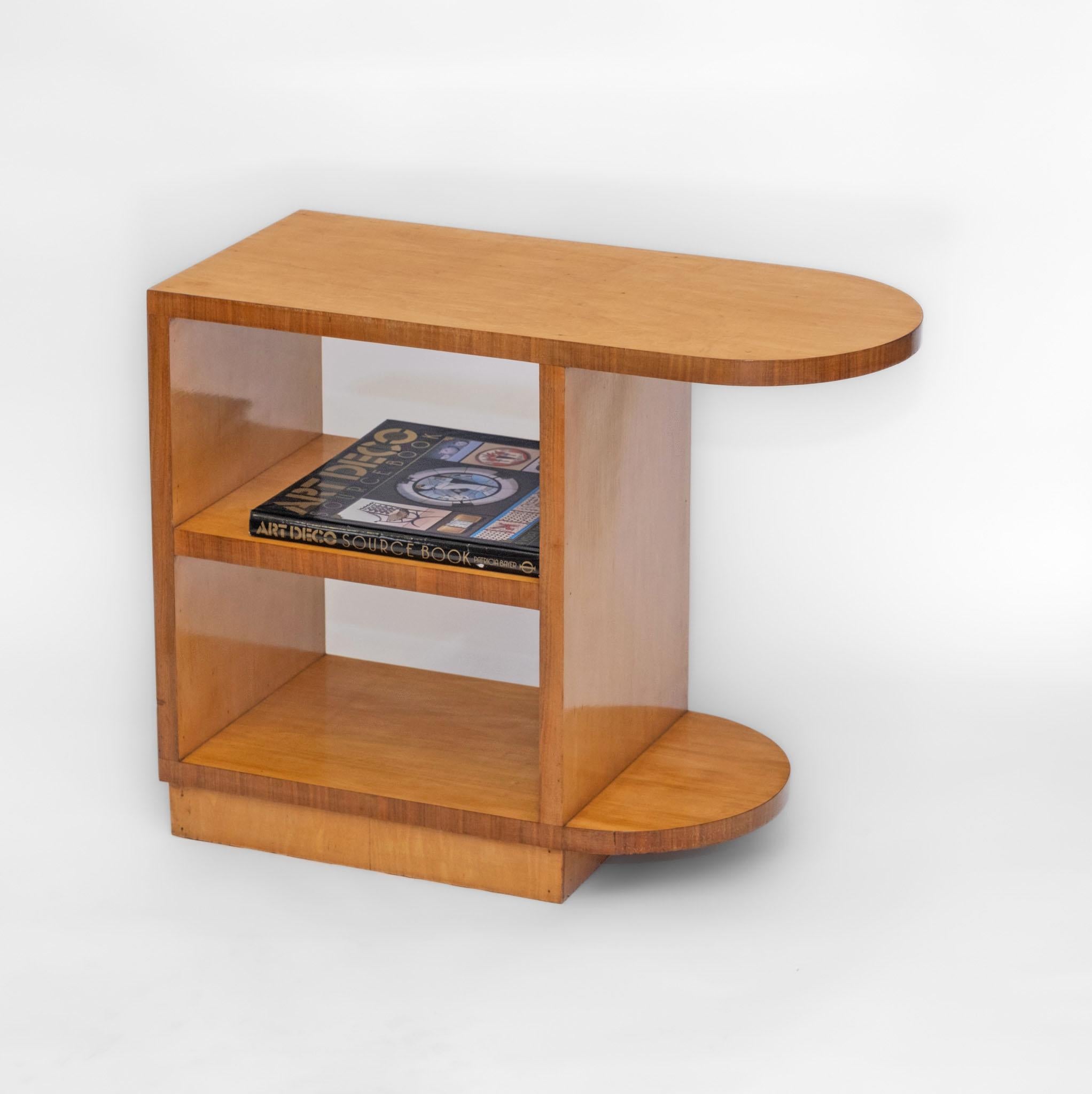 Art Deco maple & walnut tiered side table with overhanging top. English - Circa 1930s.

Veneered in maple with contrasting walnut edgings. Overall in very good condition. Re-finished by hand in a shellac, and has a smooth waxed finish, still