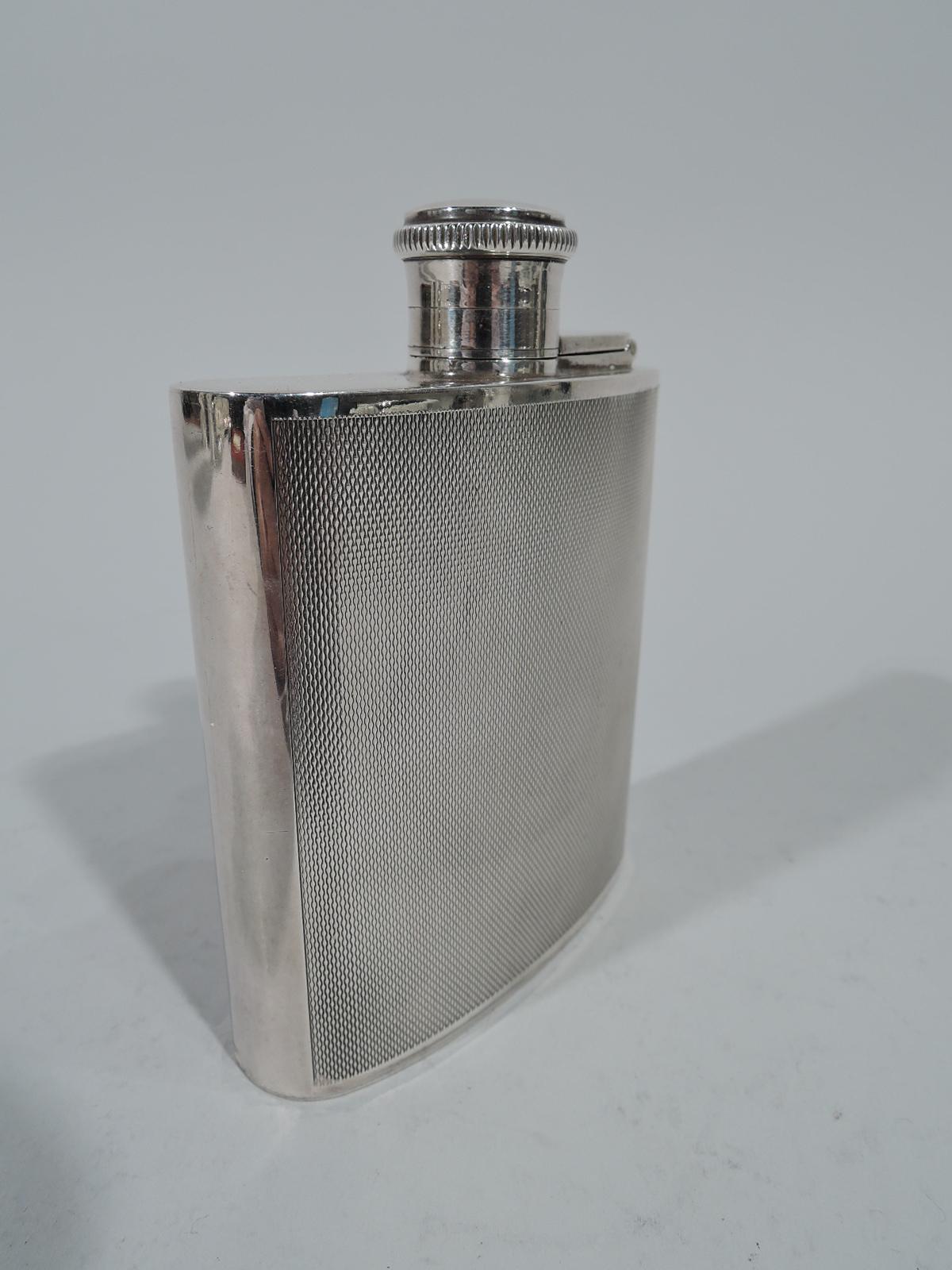 Art Deco sterling silver mini hip flask. Made by Joseph Gloster in Chester in 1939 curved body with hinged and cork-lined cover. Front and back have all-over engine-turned vertical wave pattern. Holds 1 gill. Hallmarked. Weight: 4.6 troy ounces.