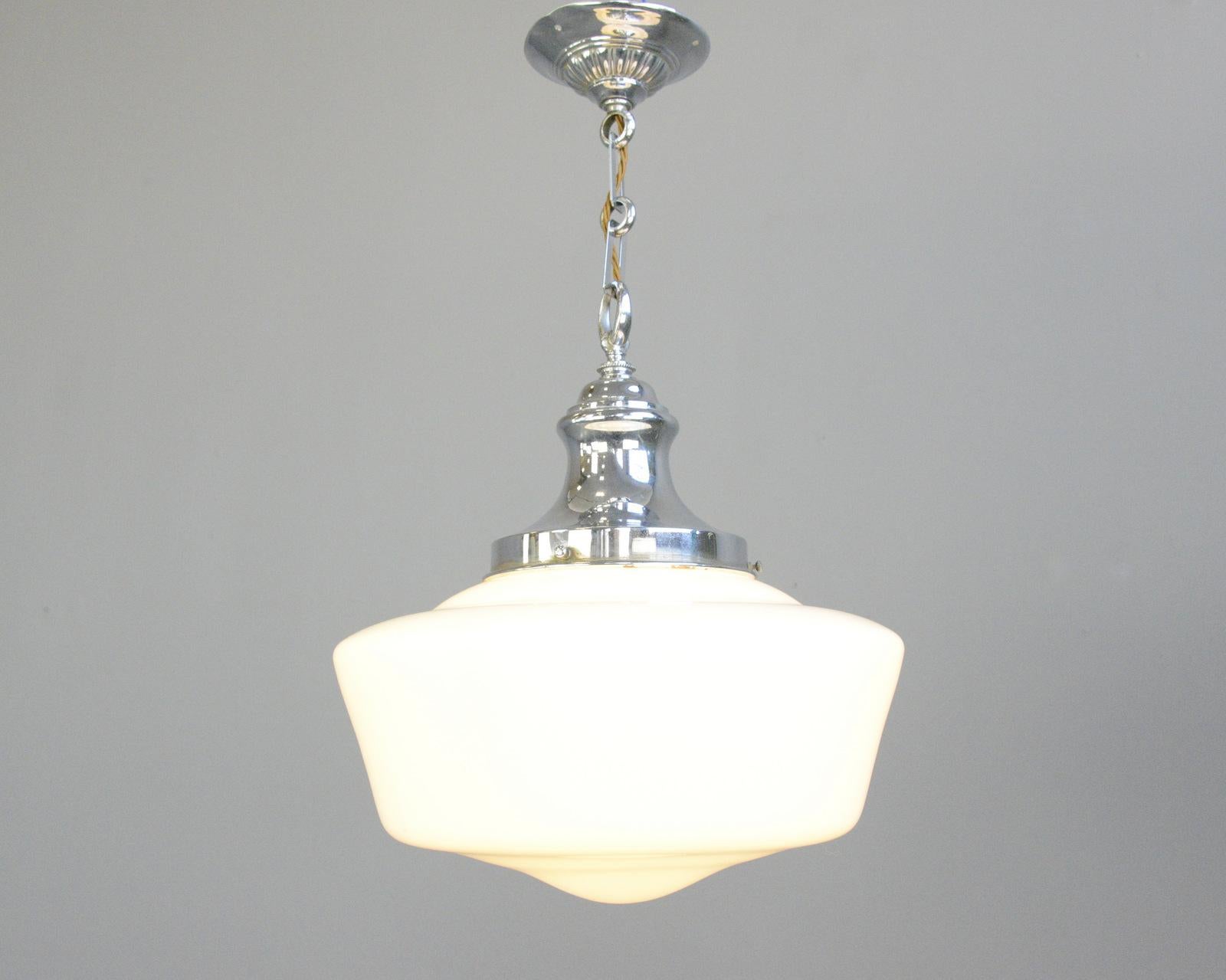 English Art Deco opaline pendant light, circa 1920s.

- Ornate nickel gallery and ceiling rose
- Takes E27 fitting bulbs
- Opaline glass
- English ~ 1920s
- 36cm wide x 38cm tall

Condition Report

Fully re wired with modern electrical