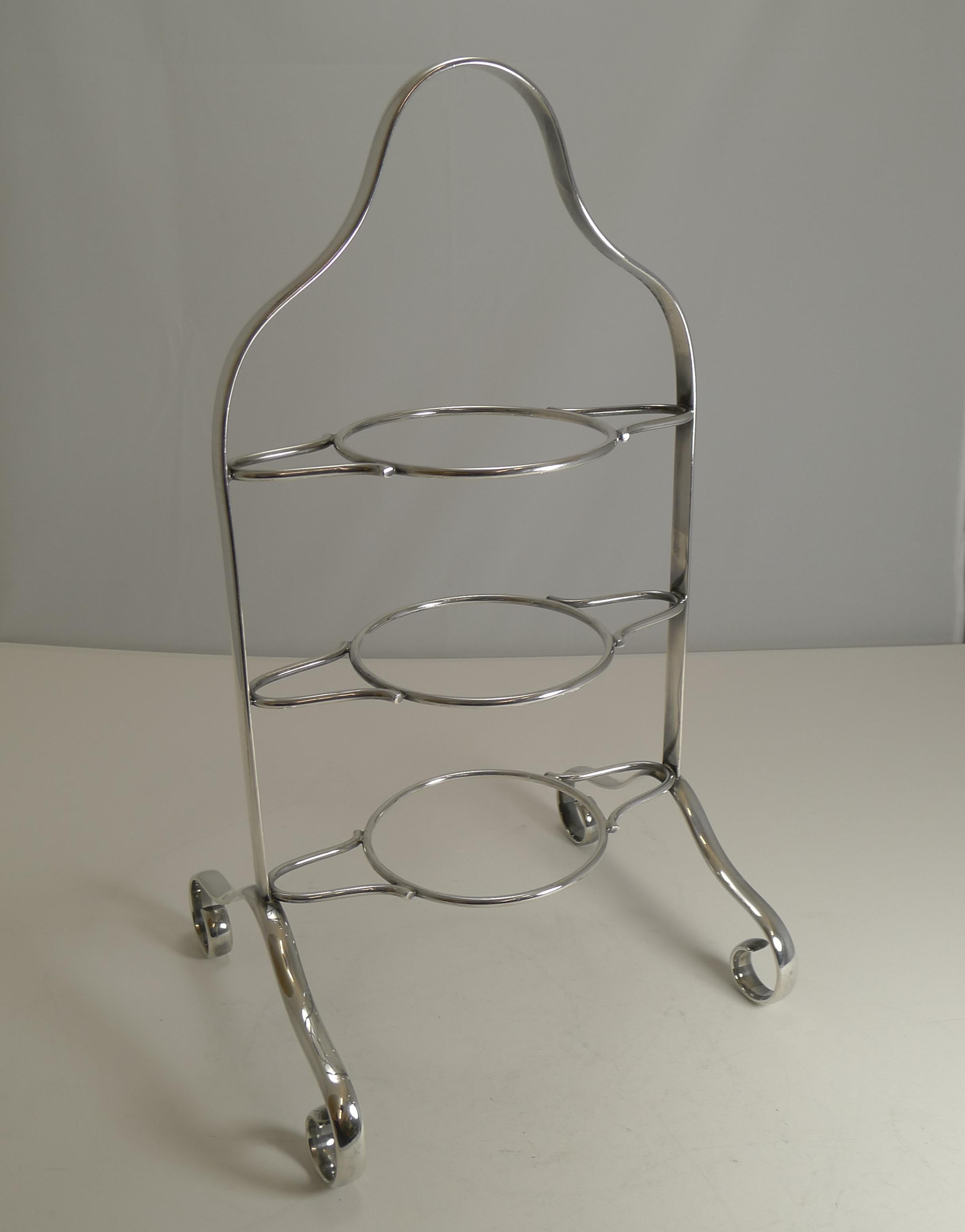 A handsome all-original Elkington Plate three tier cake stand, clean lines and elegant; all pieces having matching marks for this top-notch English silversmith. Being Elkington, we are able to date it accurately with the date letter for the year