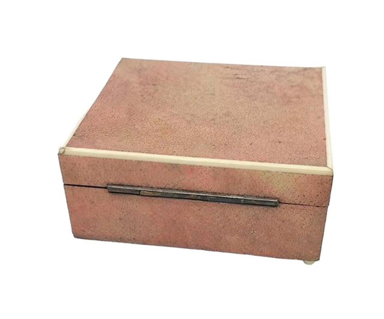 Art Deco pink shagreen covered box on ball feet and with an inset label to the bottom marked 
