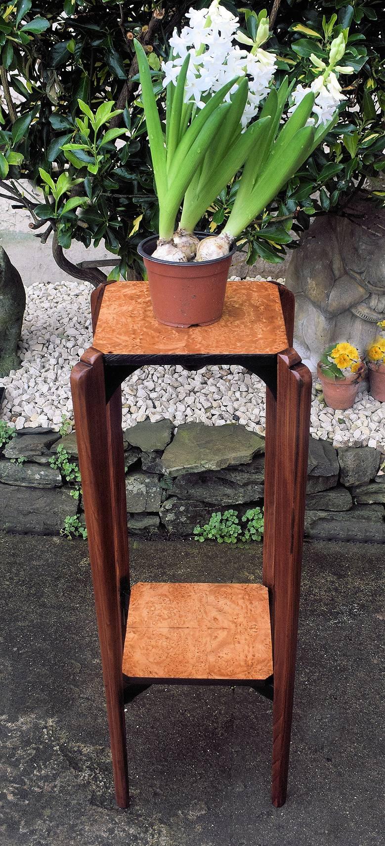 Wonderful and totally authentic 1930's Art Deco French plant stand. Two tiered in blonde birds eye maple which contrasts beautifully with the typically French tapering Rosewood legs. There are accents of ebonised wood over the whole piece