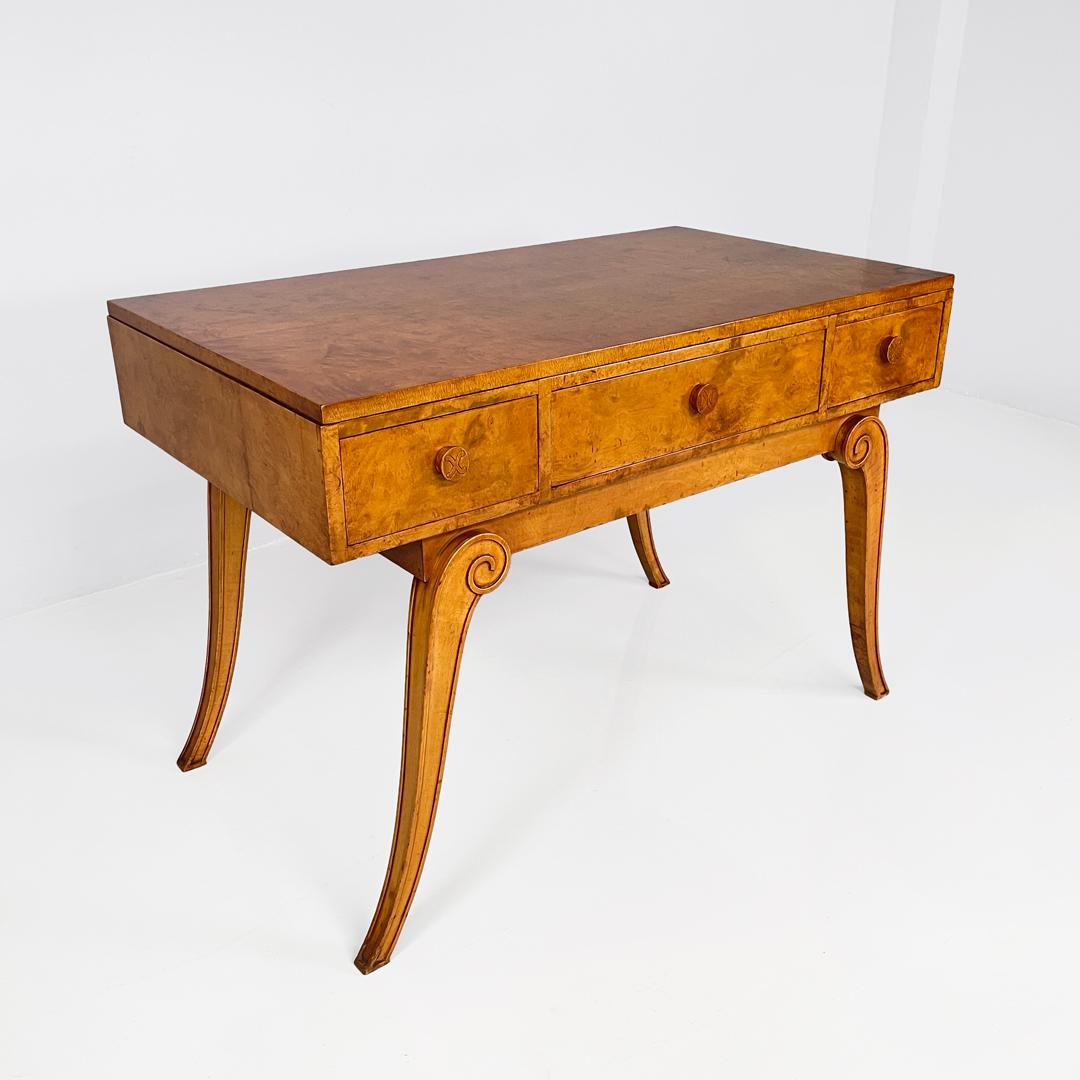 Engish Art Deco rectangular walnut desk for Hille of London, 1920s
Desk with rectangular top entirely in walnut. On the front the desk has three hidden drawers.
The square section legs are scrolled and widen towards the outside.
With logo and