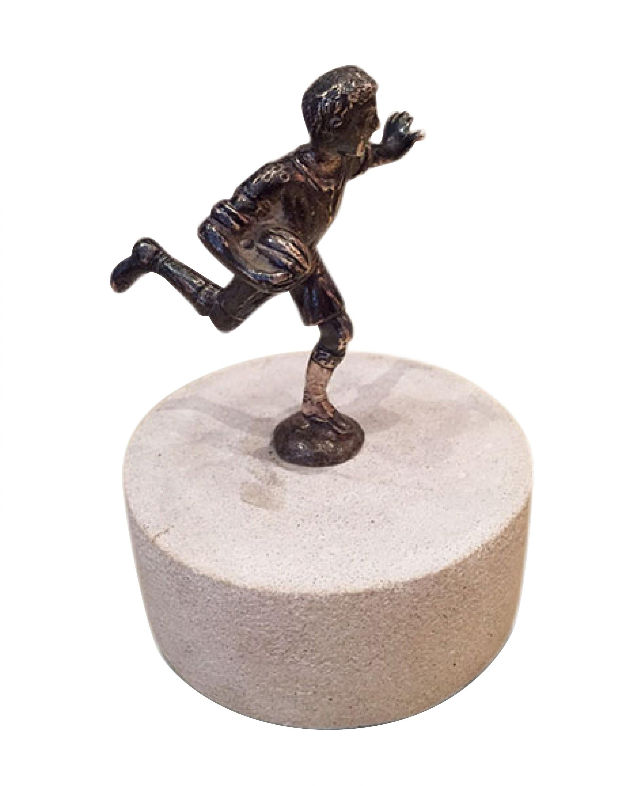 English Art Deco silver plate football (rugby) player mounted on a round white marble base (20th Cent.)