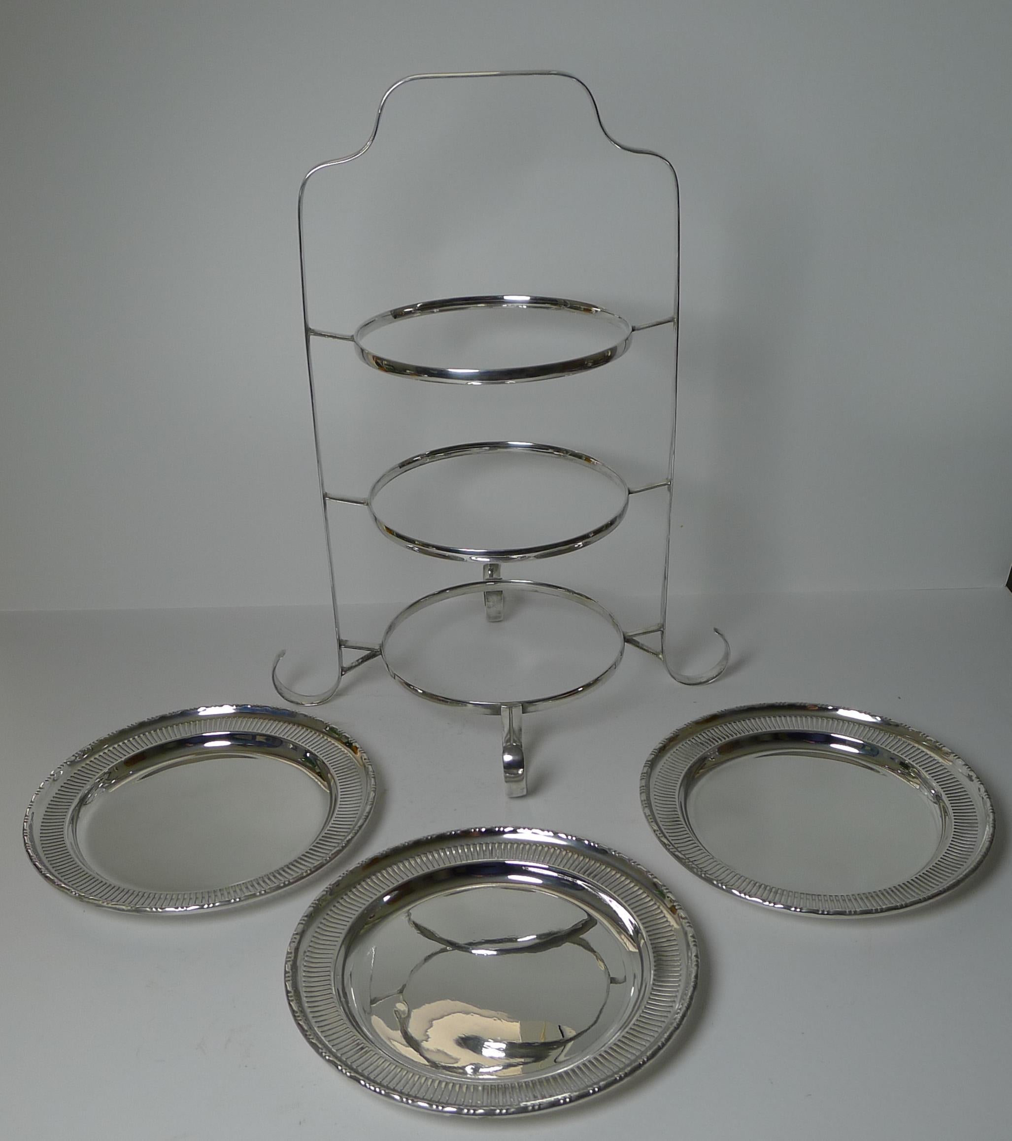 A beautiful English three-tier cake stand consisting of the stand and three circular removable plates; each plate with a pierced or reticulated border.

The stand and all three plates have matching maker's marks for Gladwin Ltd of Sheffield