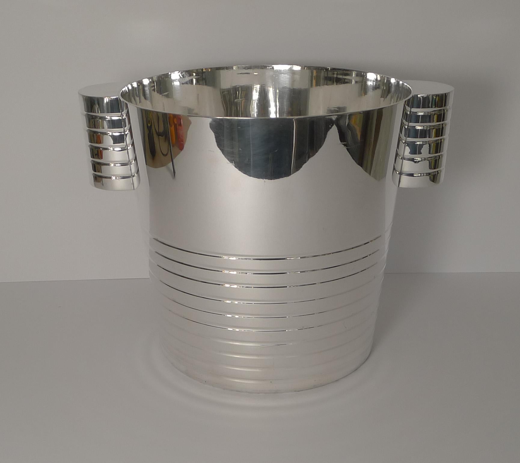A very stylish vintage silver plated champagne bucket or wine cooler very much in the manner of Luc Lanel. Luc Lanel designed a range called Ondulations made by Maison Christofle in Paris for use on the S.S. Normandie, the luxury line of the
