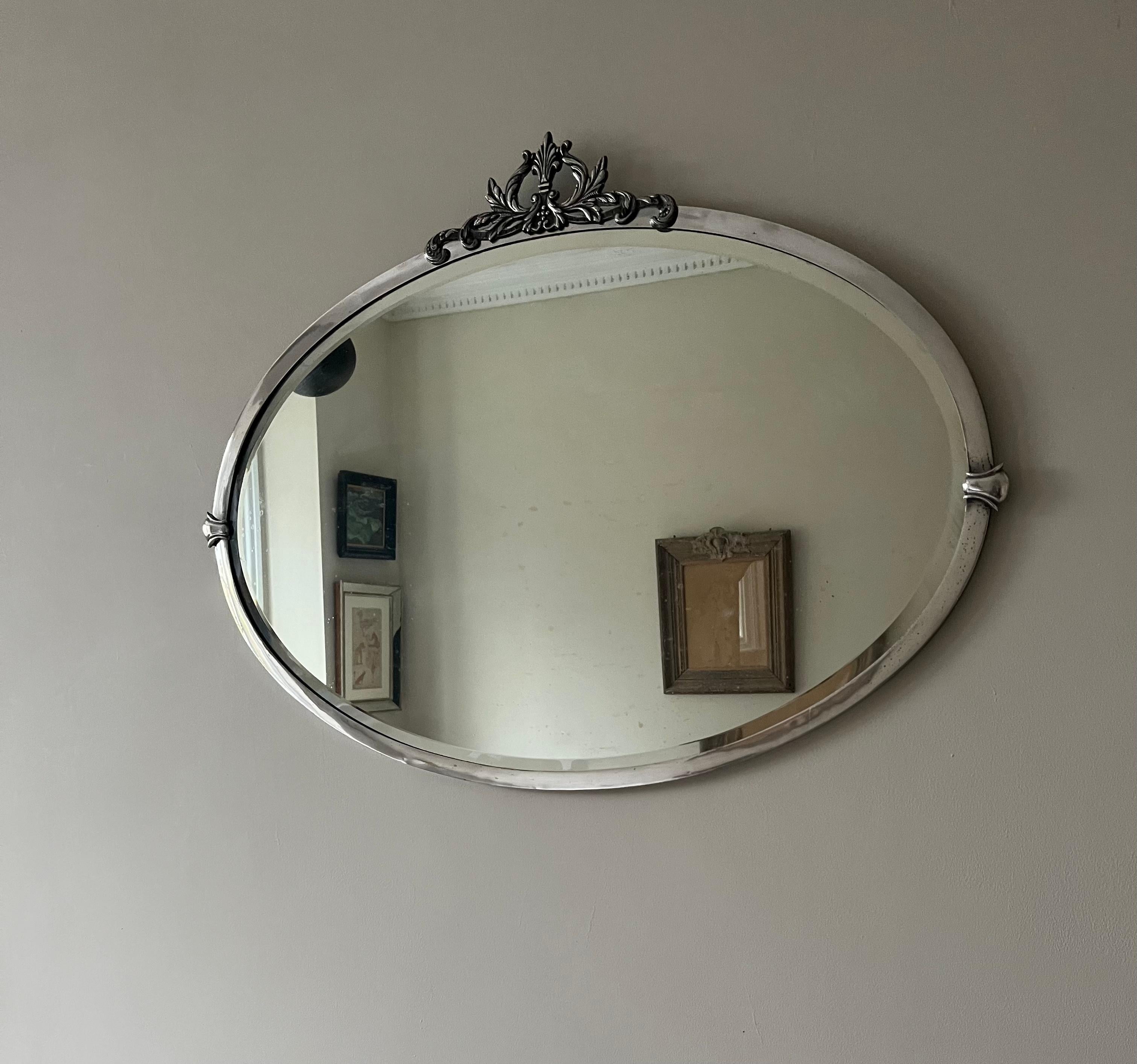 Plated English Art Deco silverplate oval mirror