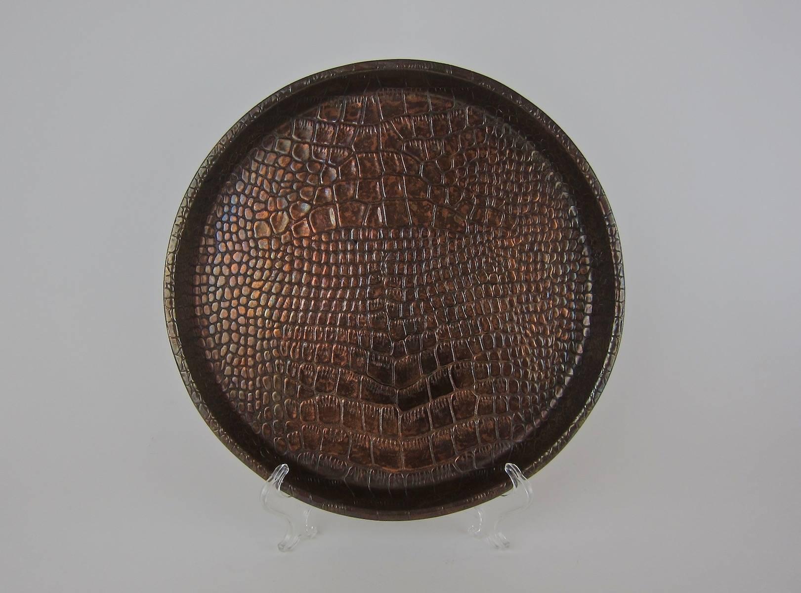 A handsome English Art Deco serving tray from Joseph Sankey and Sons, Ltd., (JS&S) of Bilston, Staffordshire. The vintage art metal tray is decorated with an embossed lizard skin pattern, measuring 12 in. Diameter -- the perfect size for cocktails,