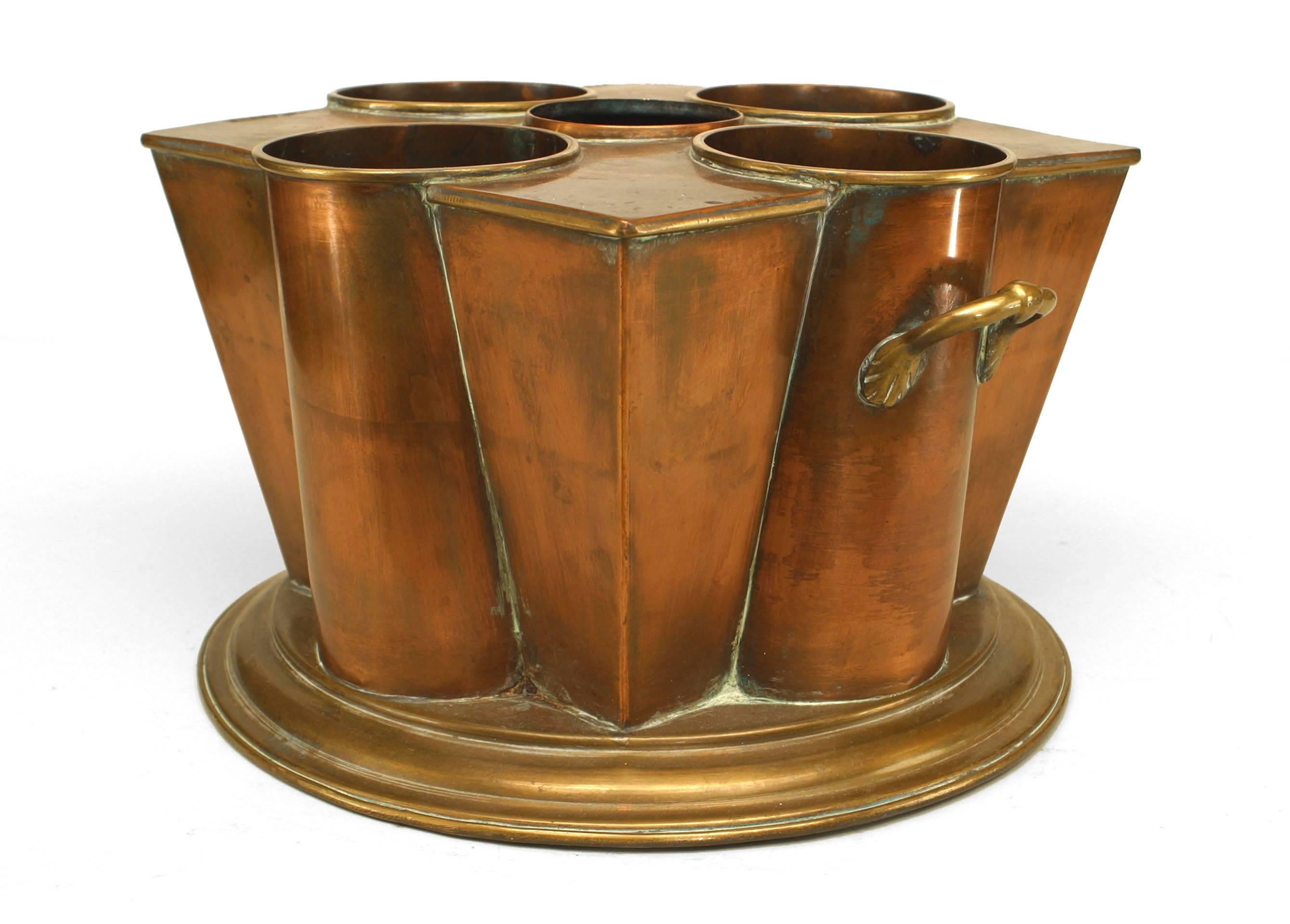 English Art Deco square tapered copper & brass wine cooler with a 4 wells centering an opening with a cover flanked by side ring handles.
