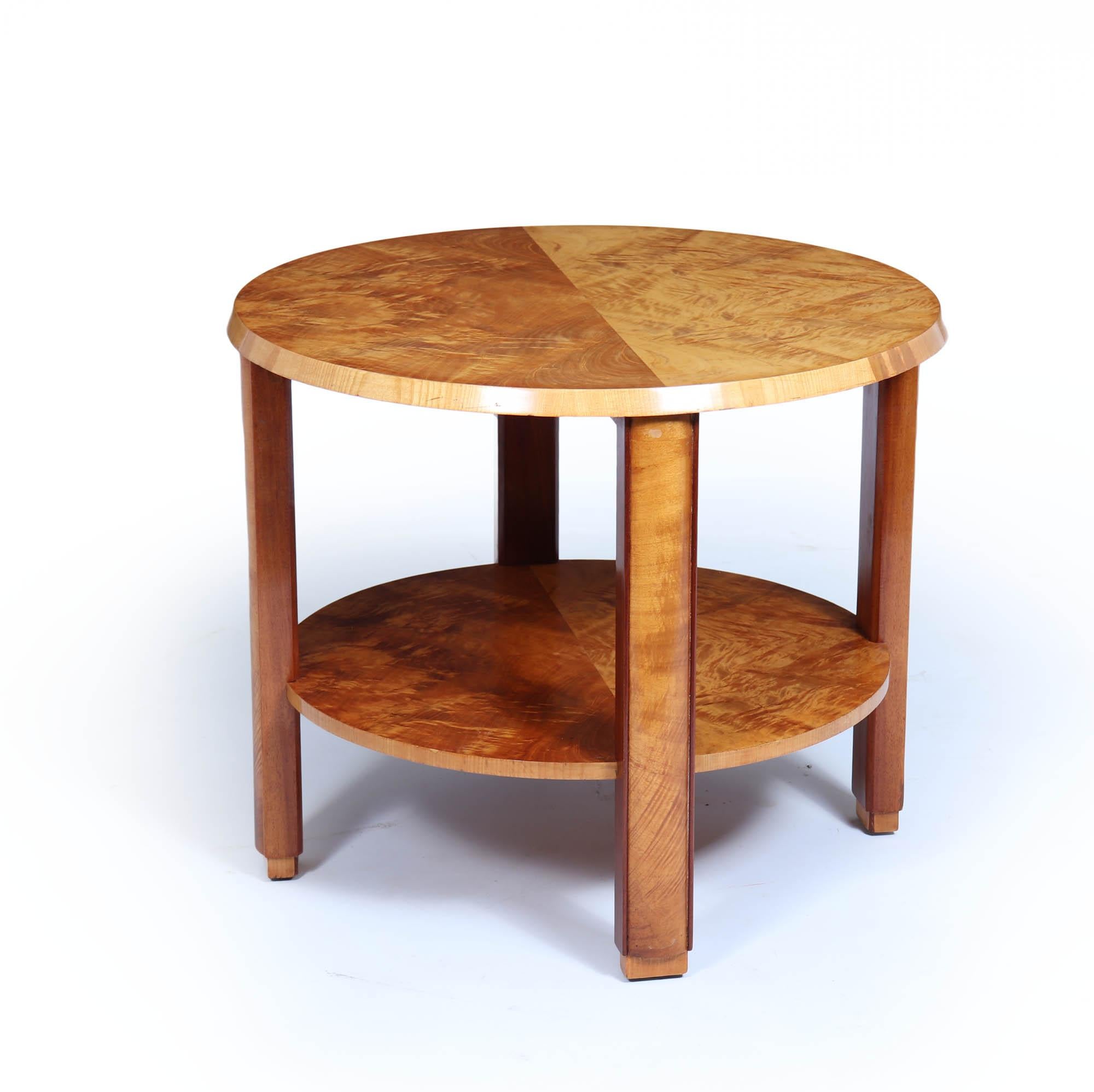 Art Deco Coffee Table 
This English Art Deco two-tier coffee table in blonde maple veneer is a stunning addition to any sophisticated living space. Its elegant design showcases the distinctive geometric lines and luxurious aesthetics characteristic