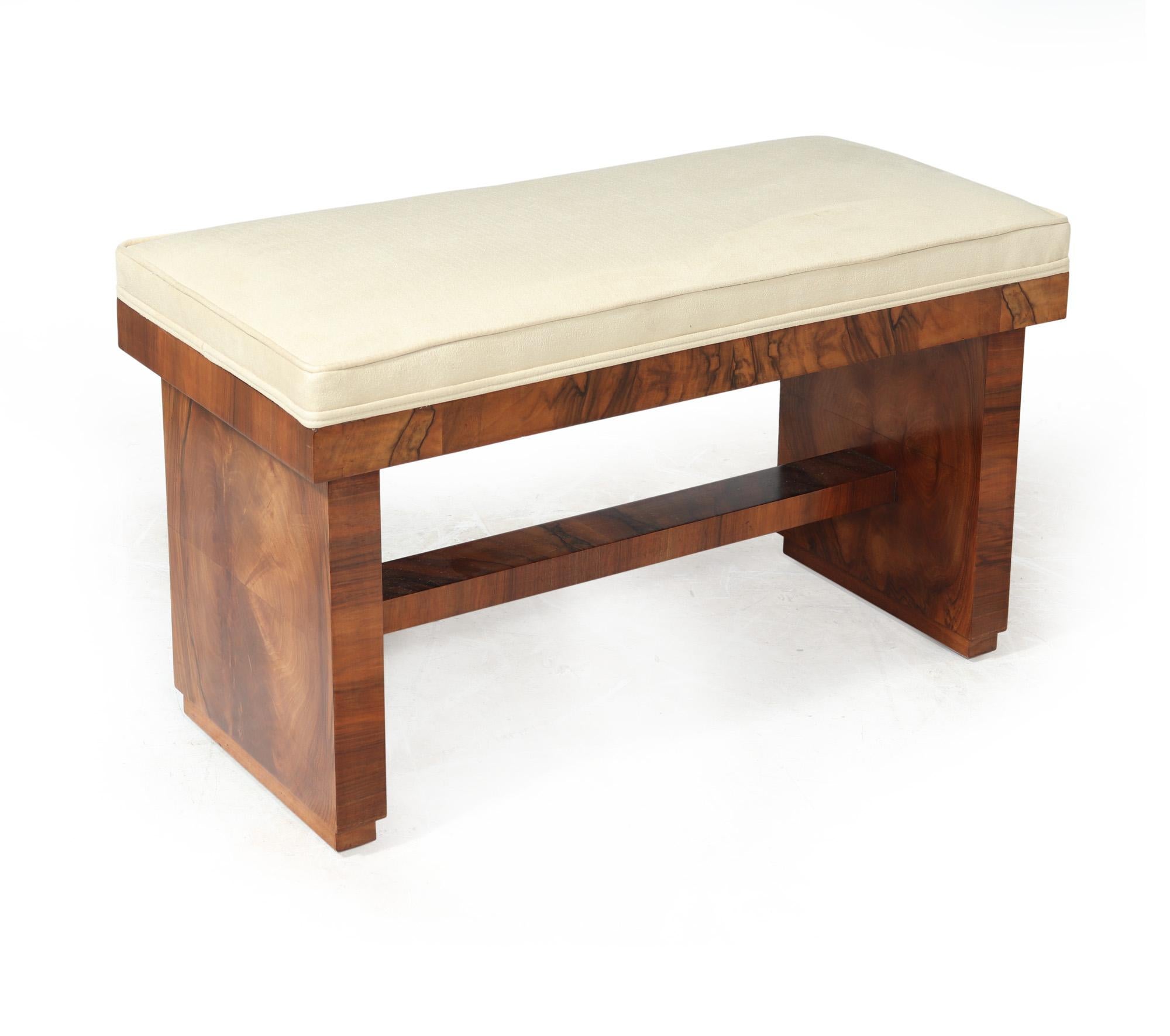 ART DECO WINDOW SEAT 
A lovely little two seat stool, would work as a window seat or at the foot of a bed produced in England in the 1930’s in figured walnut the stool has been fully upholstered with a faux suede stain resistant fabric. The stool