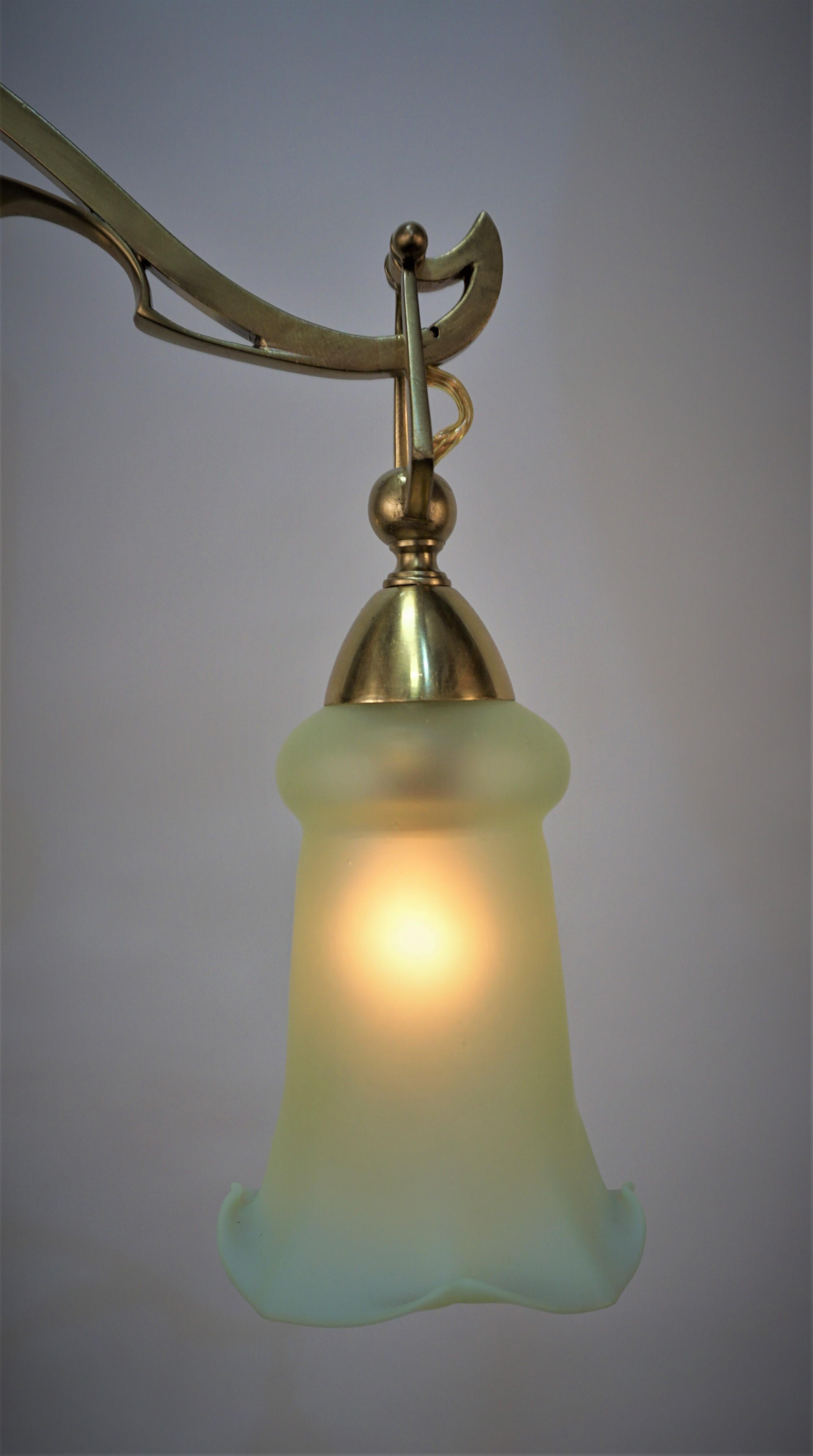 Fantastic brass Art Nouveau - Arts & Crafts chandelier with three beautiful opalescent glass shades.