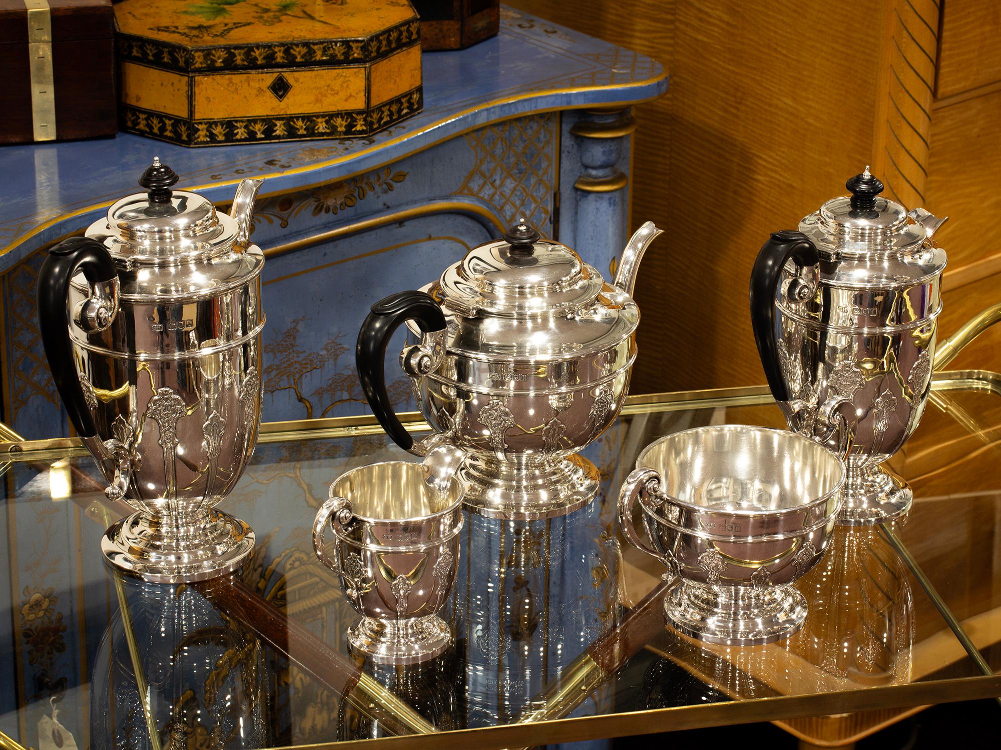 Five Piece Set

From our Silver collection, we are delighted to offer this Art Nouveau Sterling Silver Tea Set. The Tea Set comprises of five pieces including a teapot, coffee pot, hot water jug, milk jug and sugar bowl. Each piece is meticulously