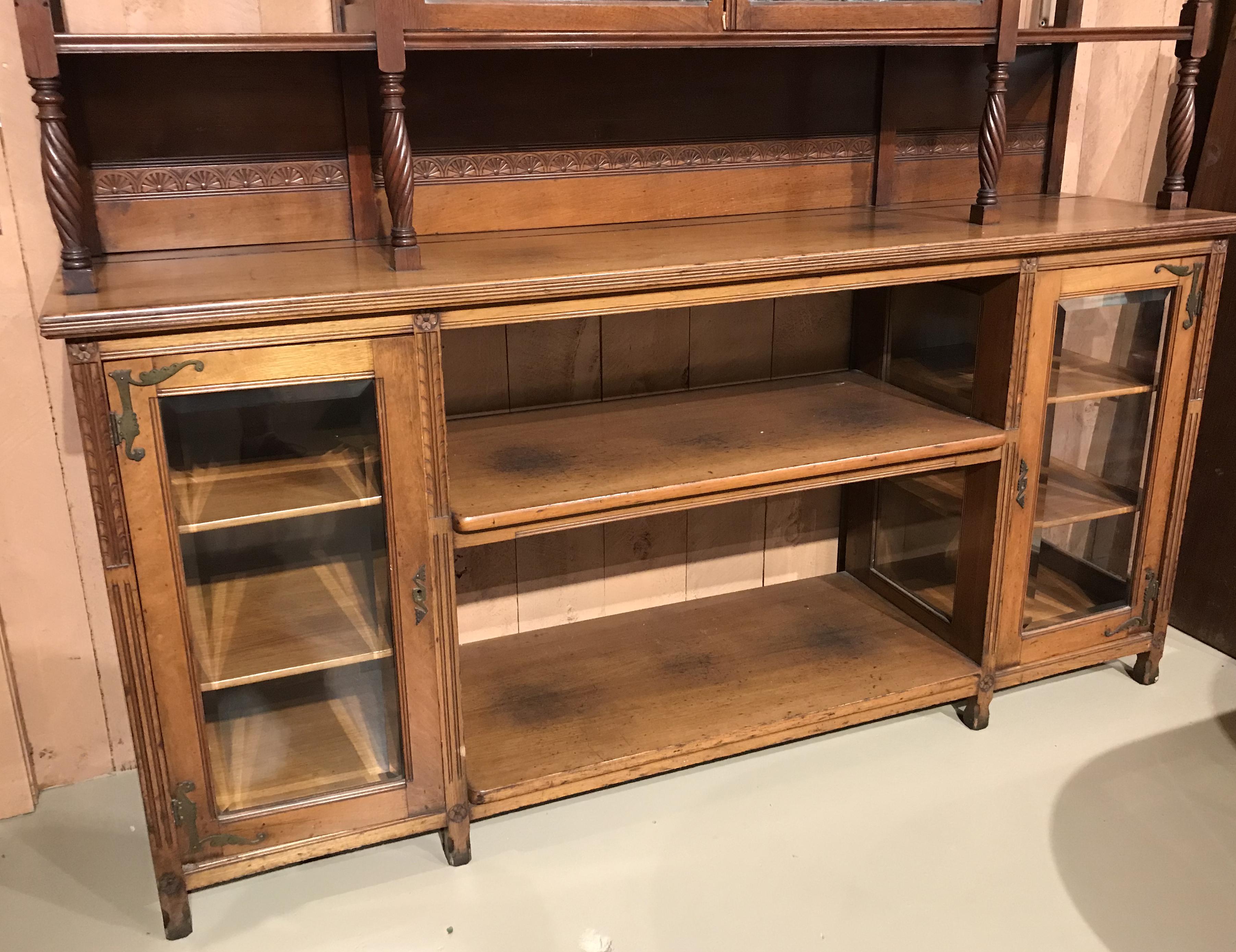 walnut bookcase with glass doors