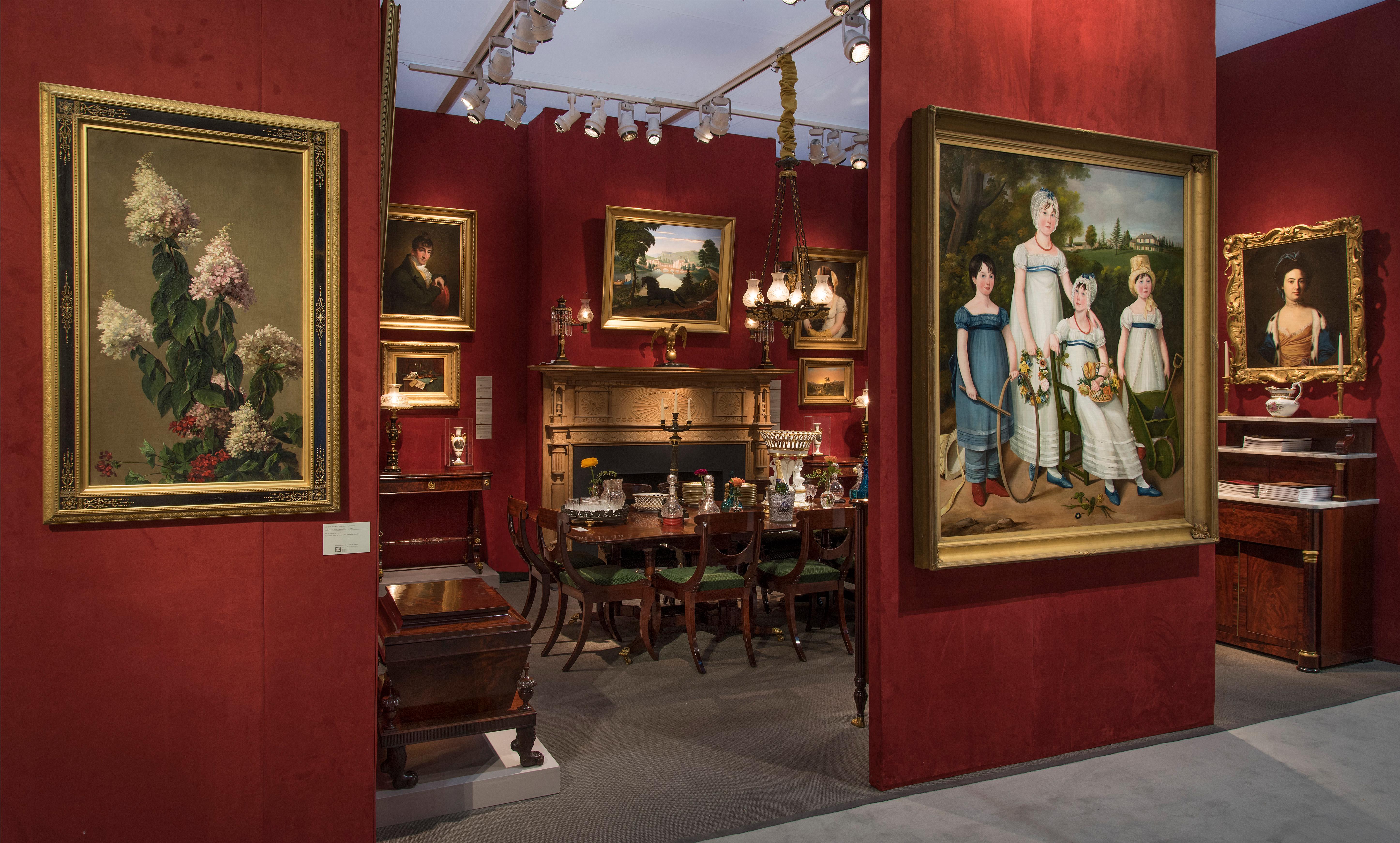 Portrait de famille avec quatre enfants dans un paysage champêtre 1