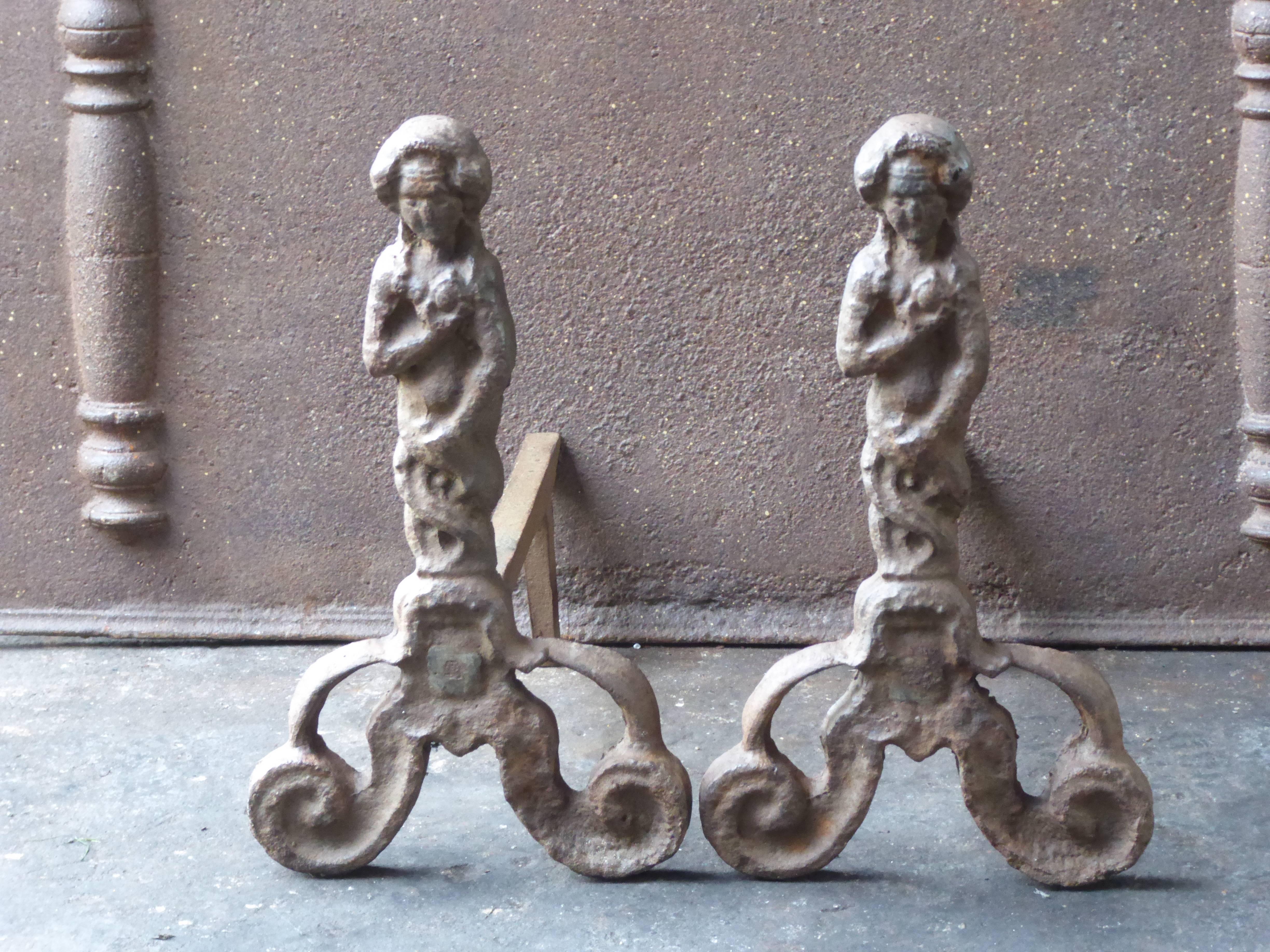 Beautiful English Arts & Crafts andirons made of cast iron. The condition is good.

