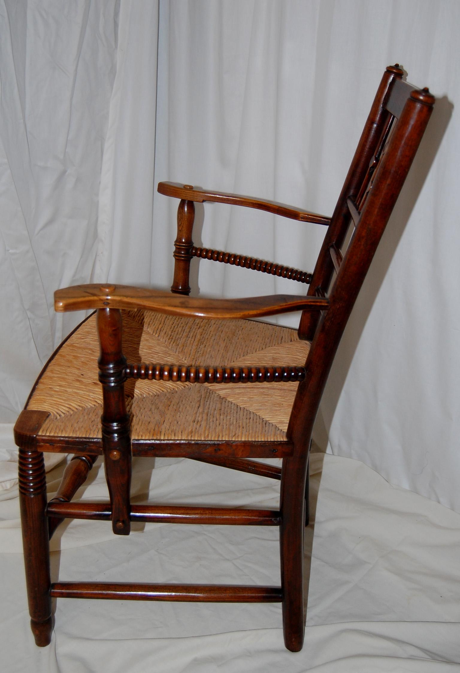 Late 19th Century English Arts and Crafts Period Spindle Back Rush Seated  Elm Armchair For Sale