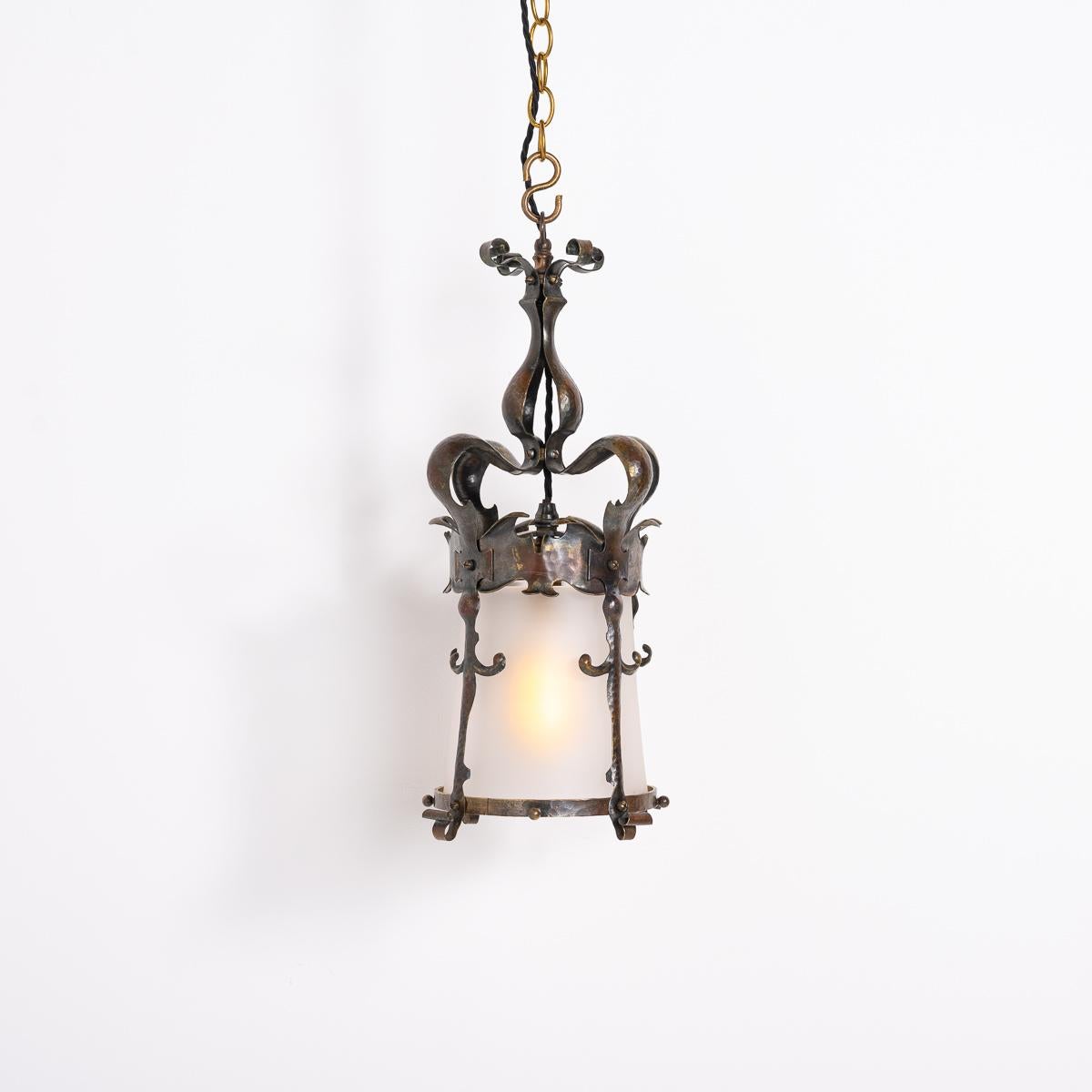 English Hand Crafted Brass and Frosted Glass Hall Lantern

A quality English arts & crafts lantern with frosted glass cylinder shade.

Hand crafted from brass the lanterns metalwork is intricately shaped with a flowing design typical of the Arts &