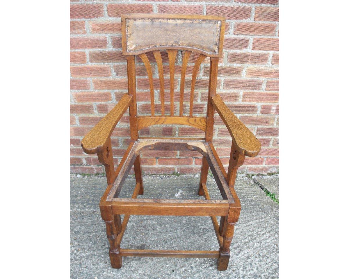 Shapland and Petter attributed.
An English Arts & Crafts oak dining chair with stylized floral cut-outs to the arms which follow through to the lower stretcher giving it more strength with a little style.
This armchair is ready for professional