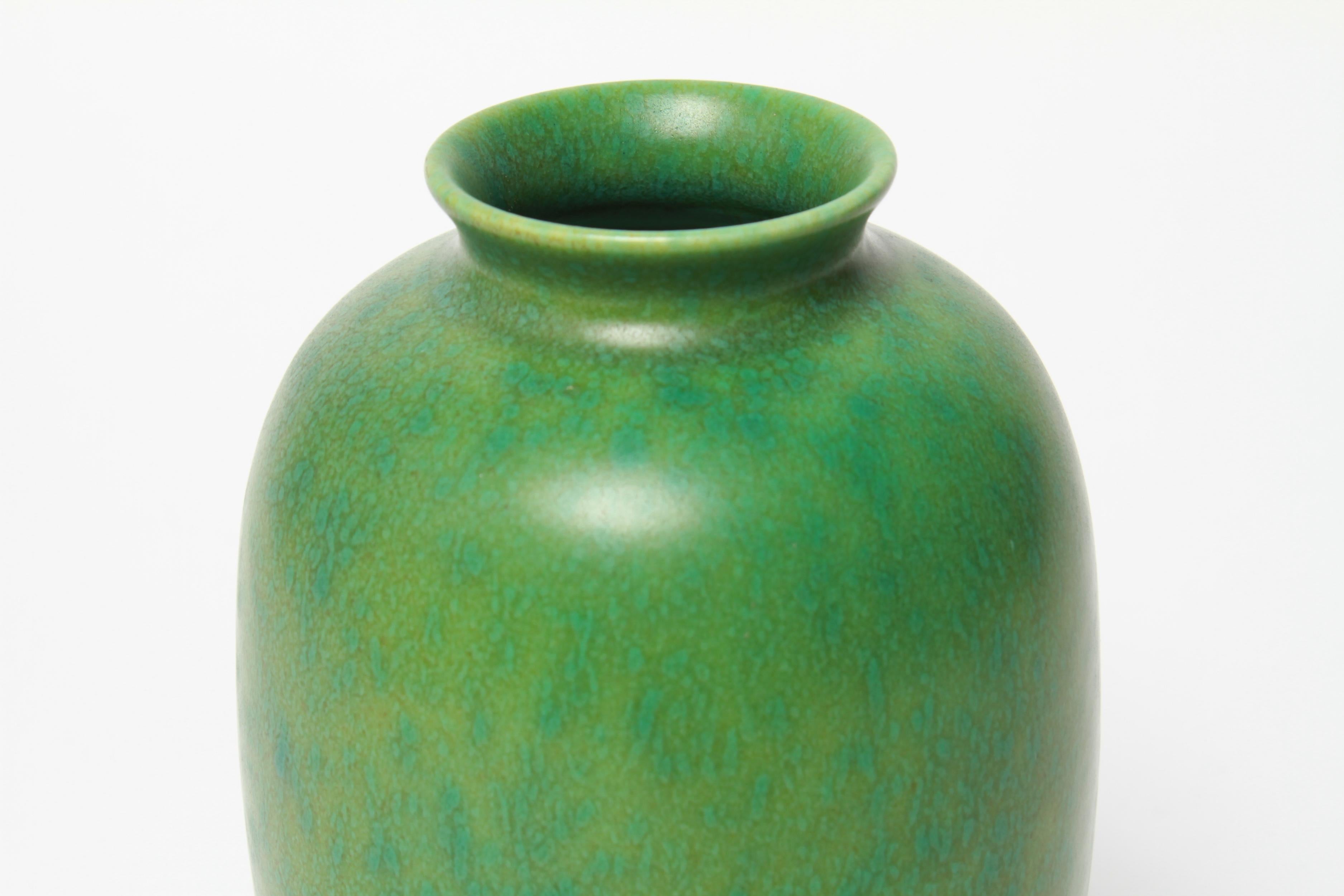 English Arts & Crafts Royal Lancastrian Pilkington mottled matte green vase. The piece has impressed maker's marks on the bottom: 