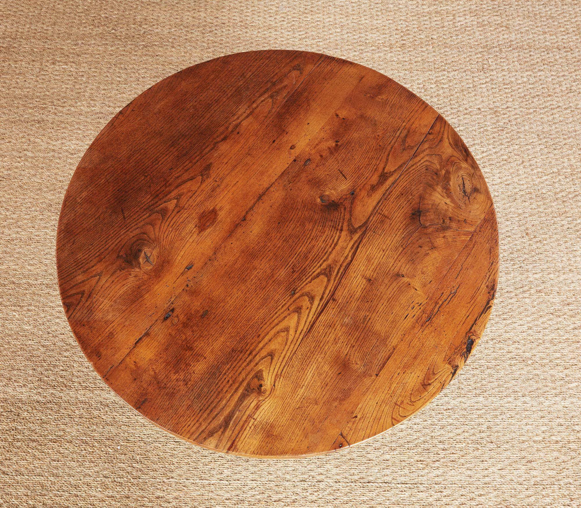 Early 19th century English ash cricket table, the three plank top with pleasant graining, over splayed square legs joined by lower shelf, having good proportions, stance and patina.