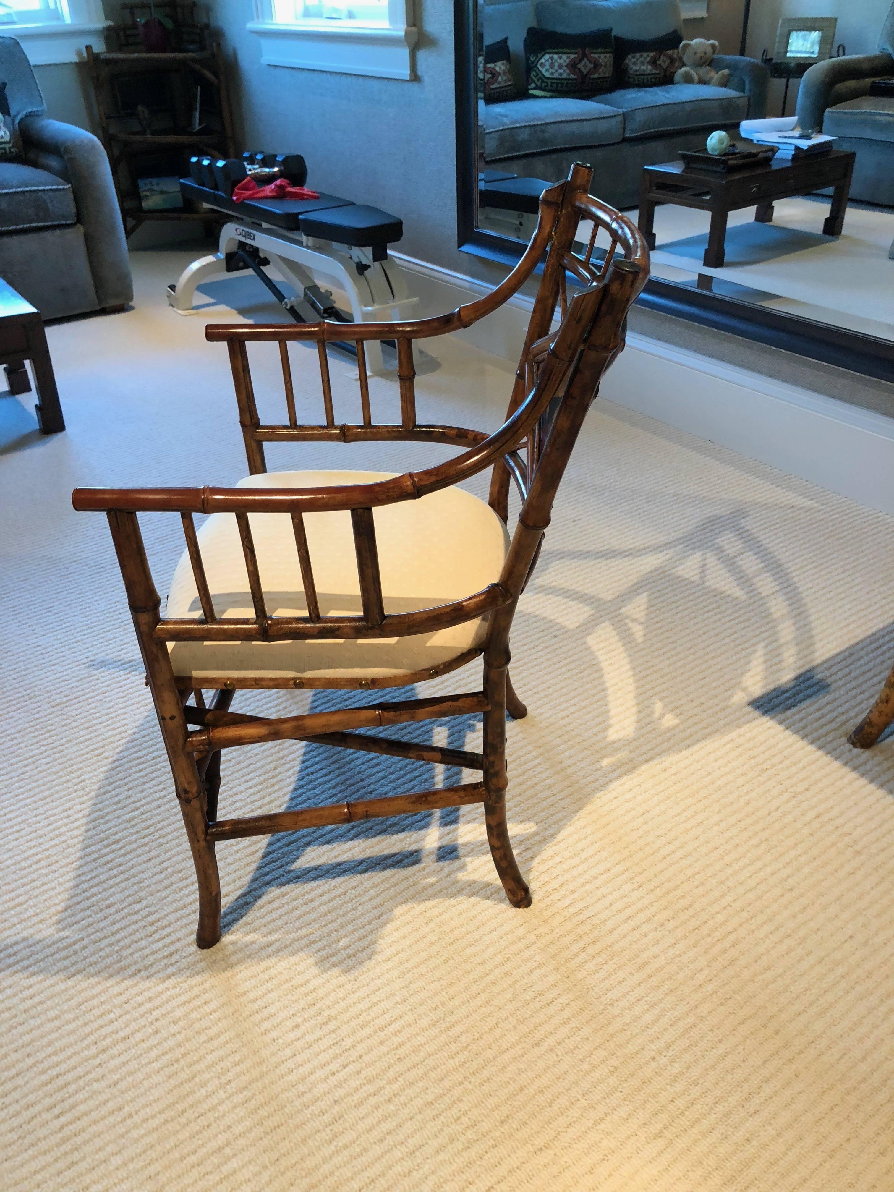 English bamboo armchair the inset back has hand-painted design with a lacquered panel in the Japanese style this became popular after Commodore Perry opened Japan to the West!

 