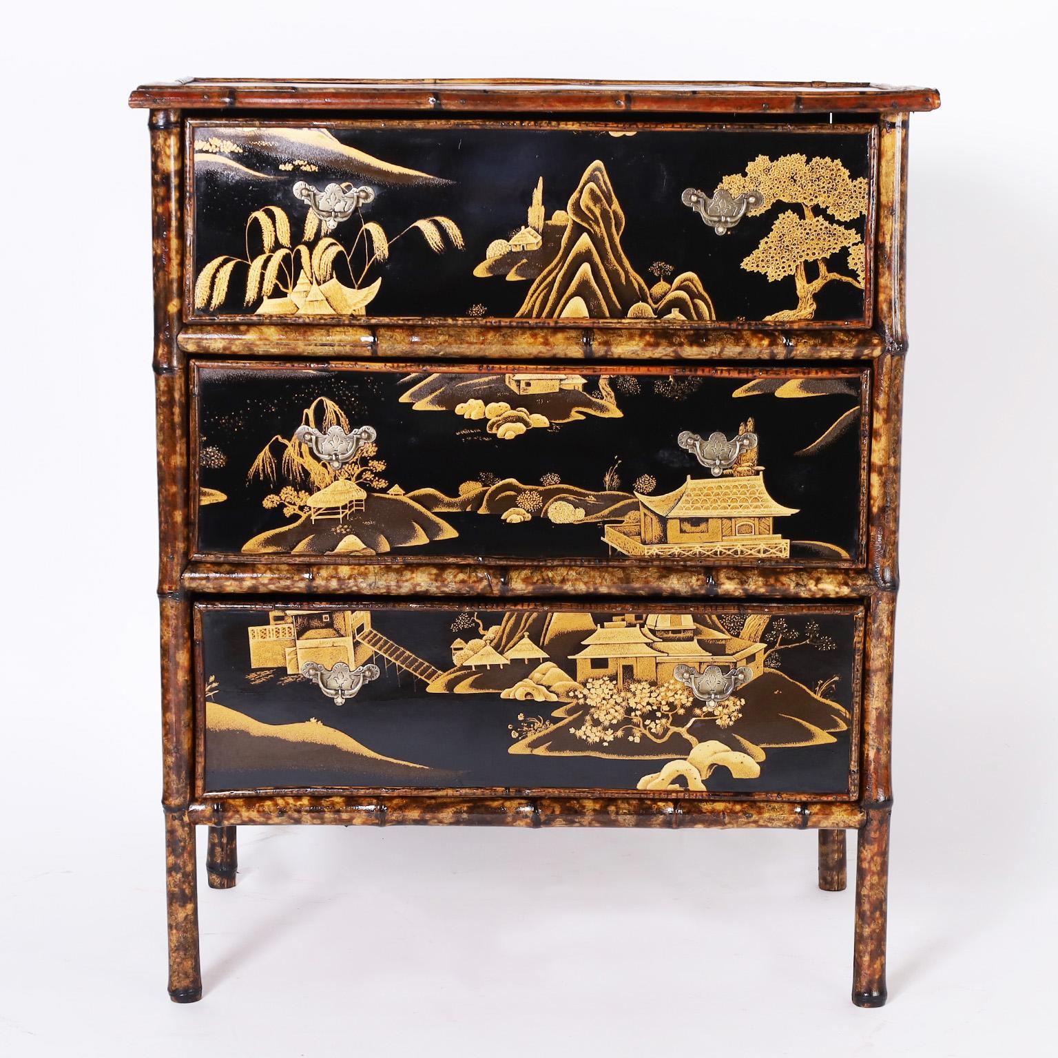 Impressive 19th century English three drawer chest with a bamboo frame and decorated in classic chinoiserie scenes of houses, trees, and mountains in a lacquer technique. Best of the genre.