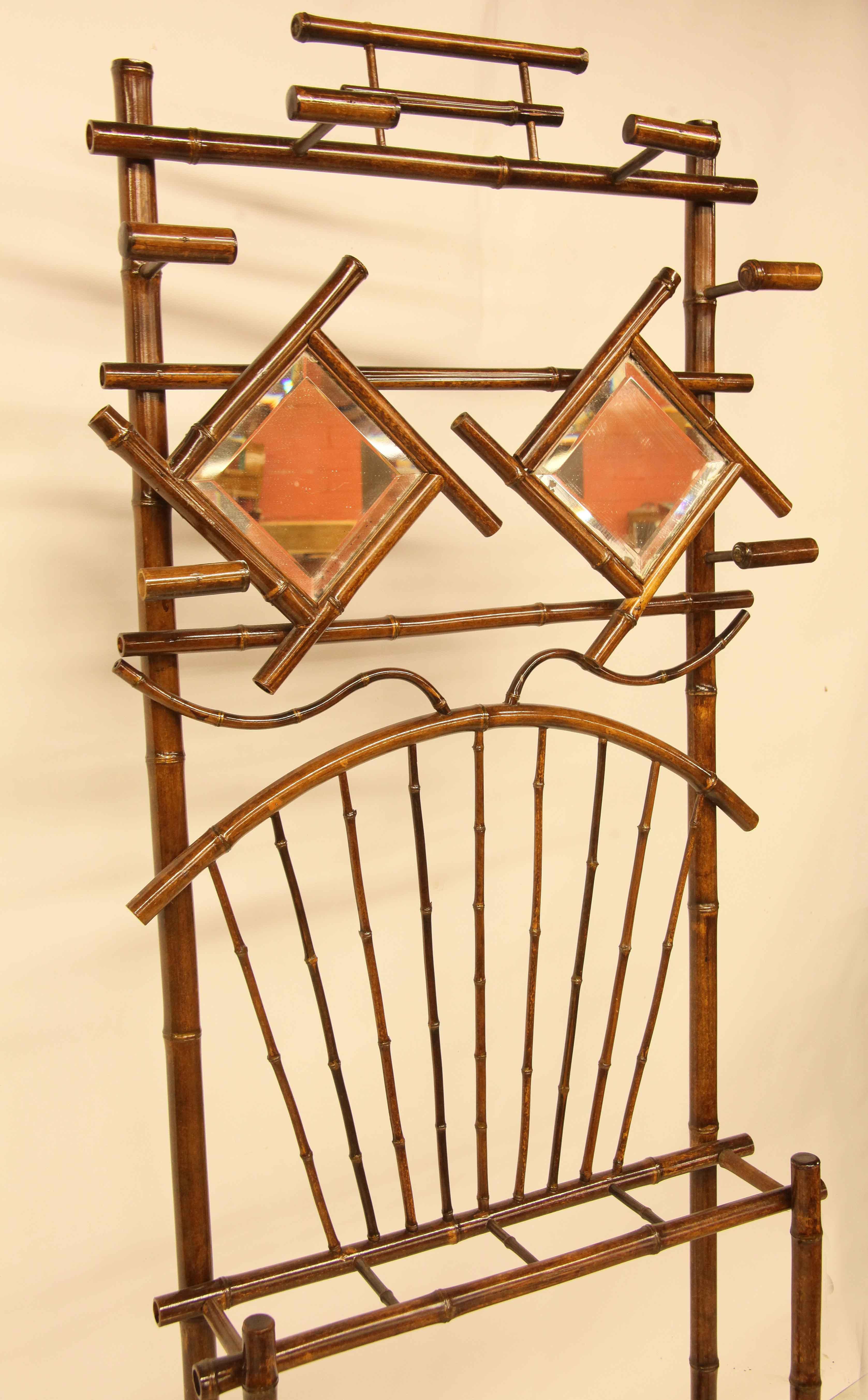 English bamboo hall stand, with bamboo ''hooks'' for hanging coats or hats, twin beveled mirrors above bamboo 
