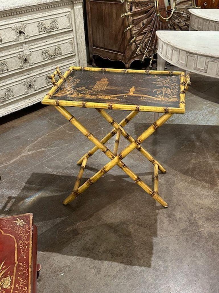 Vintage English bamboo and chinoiserie decorated tray table. Circa 1960. A timeless and classic touch for a fine interior.
