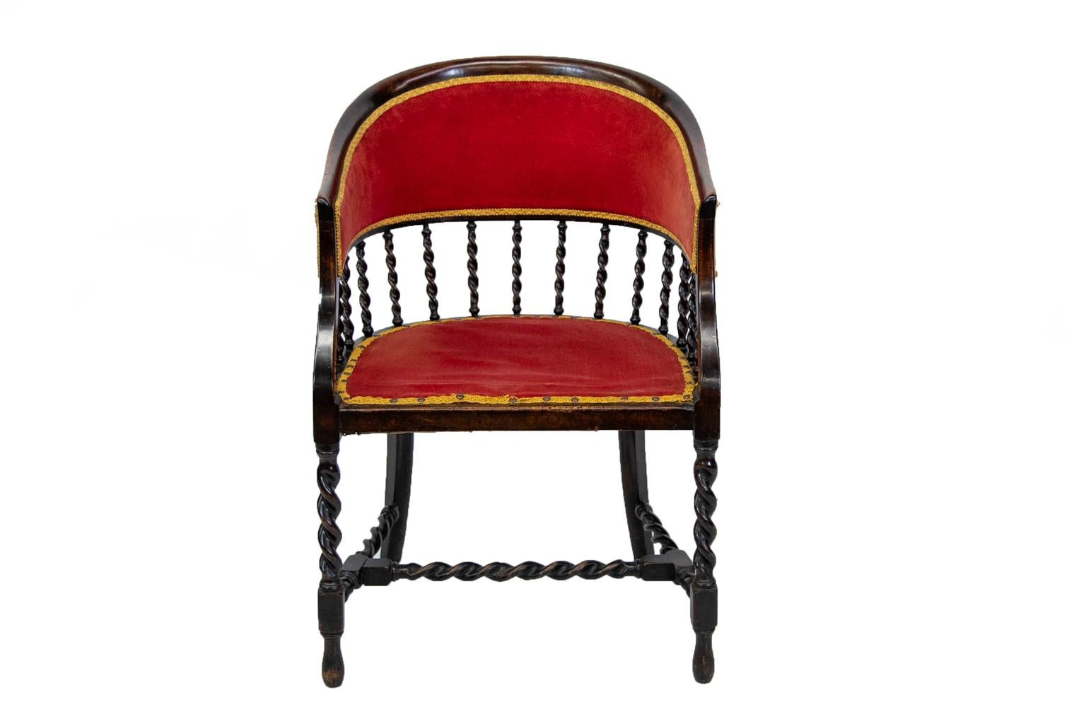 English Barley Twist barrel back armchair, with the back supported by fifteen barley twist spindles. The legs and cross stretchers also have barley twist turnings.