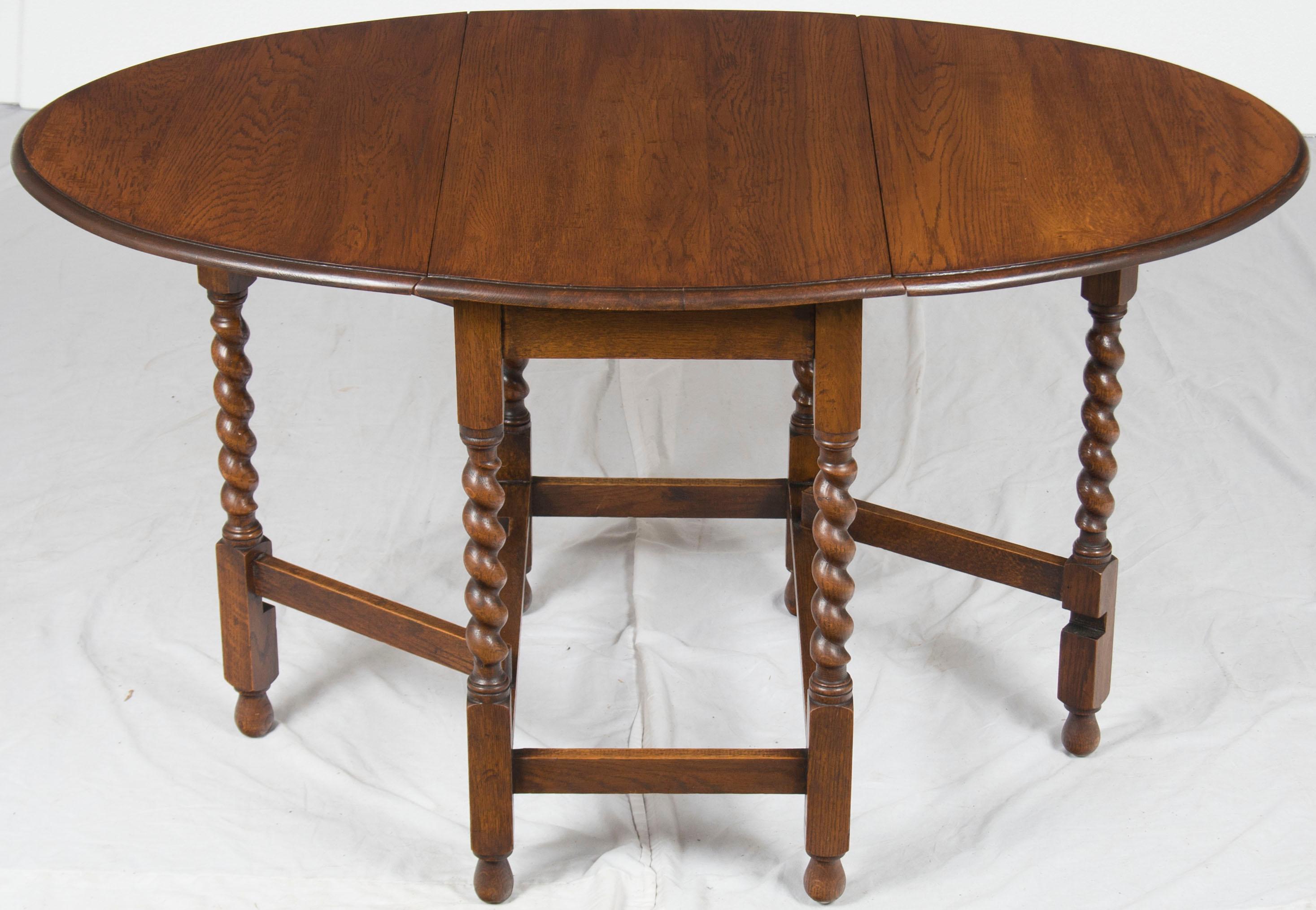 This oak gate leg table was made in England sometime, circa 1920. Gate leg tables are quite flexible in their use and fit a wide range of needs. Use then with one leaf open, both, or neither. This flexibility allows a table to be stored to the side