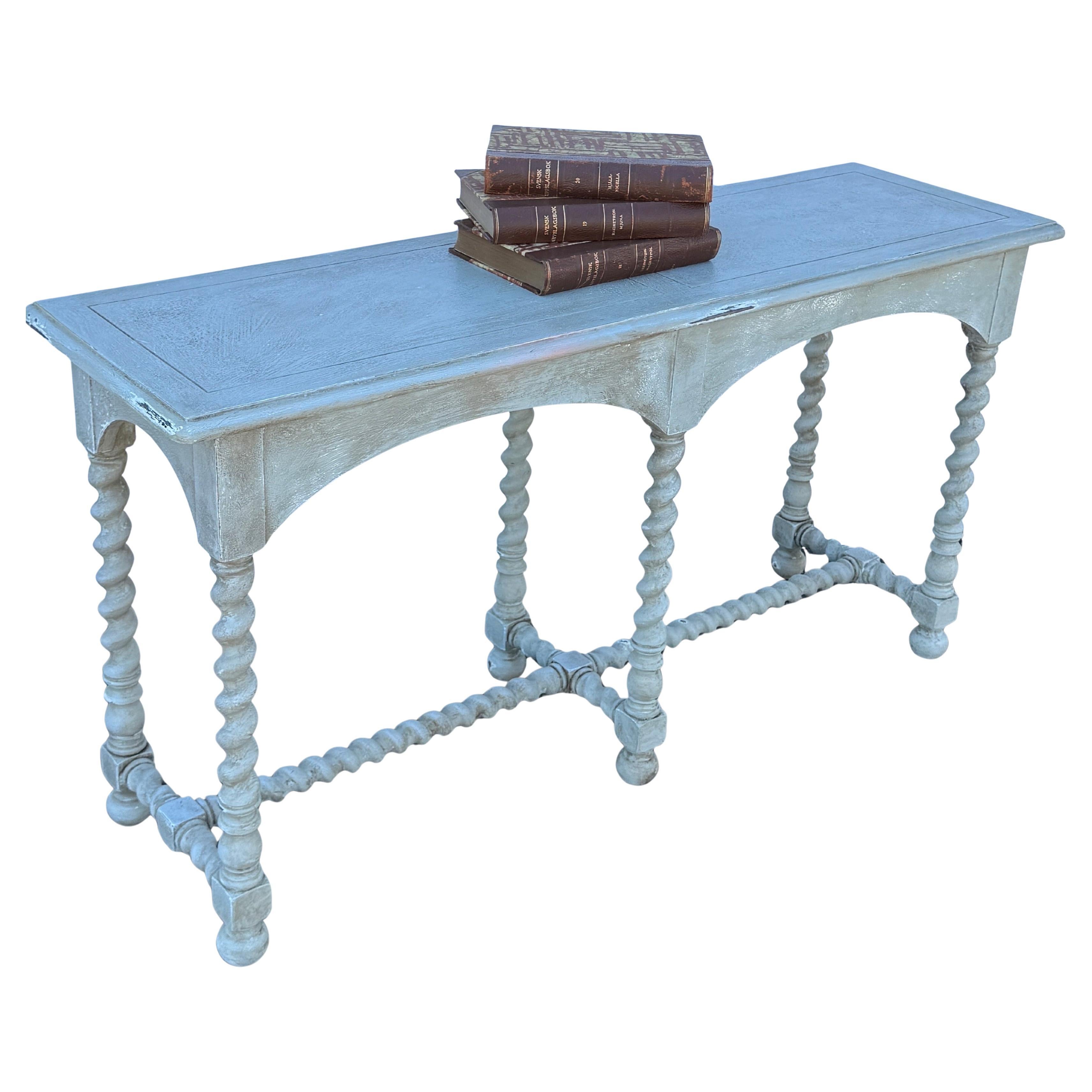 This English barley twist hand painted, in neutral gray with a tint of green, features wonderful classic details. This color is a classic Gustavian gray as well as period texture. Additionally there are two pull out shelves for candlesticks. If you