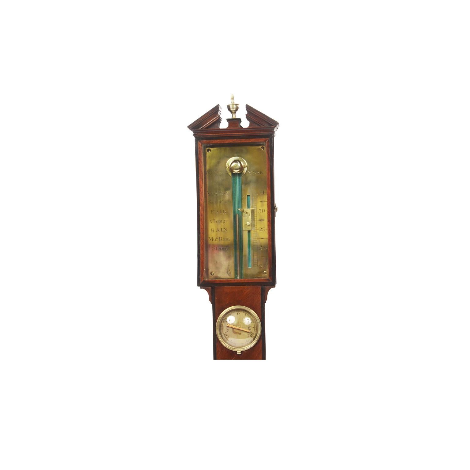 English barometer of mahogany wood signed Wisker York from the early 19th century, complete with reading vernier for checking the variation in pressure, large thermometer and hygrometer. Height 103 cm - 40.55 inches, width 12.5 cm - 4.9 inches,