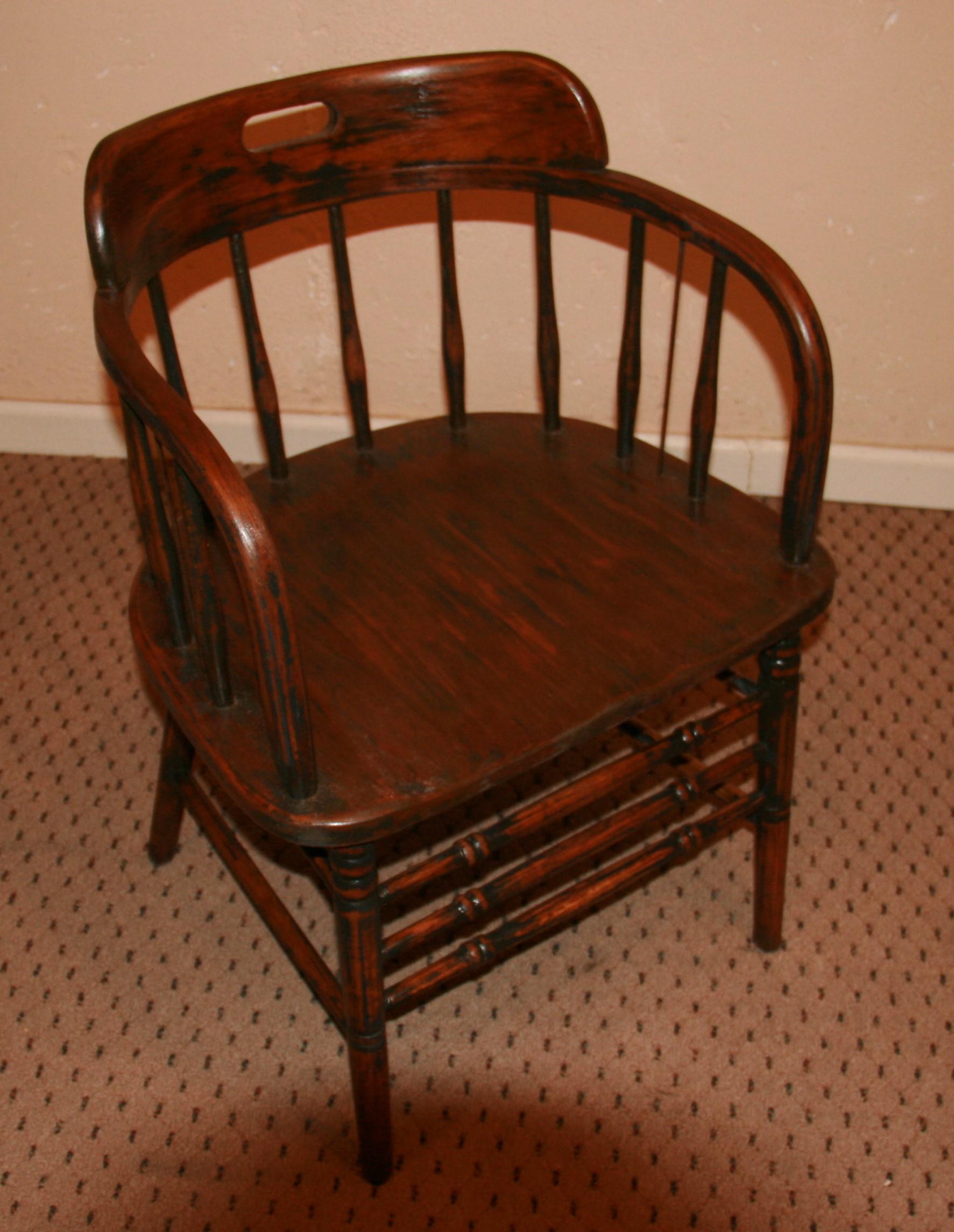 English barrel back hardwood chair with curved arm support ,saddled seat and turned legs and stretcher, great color