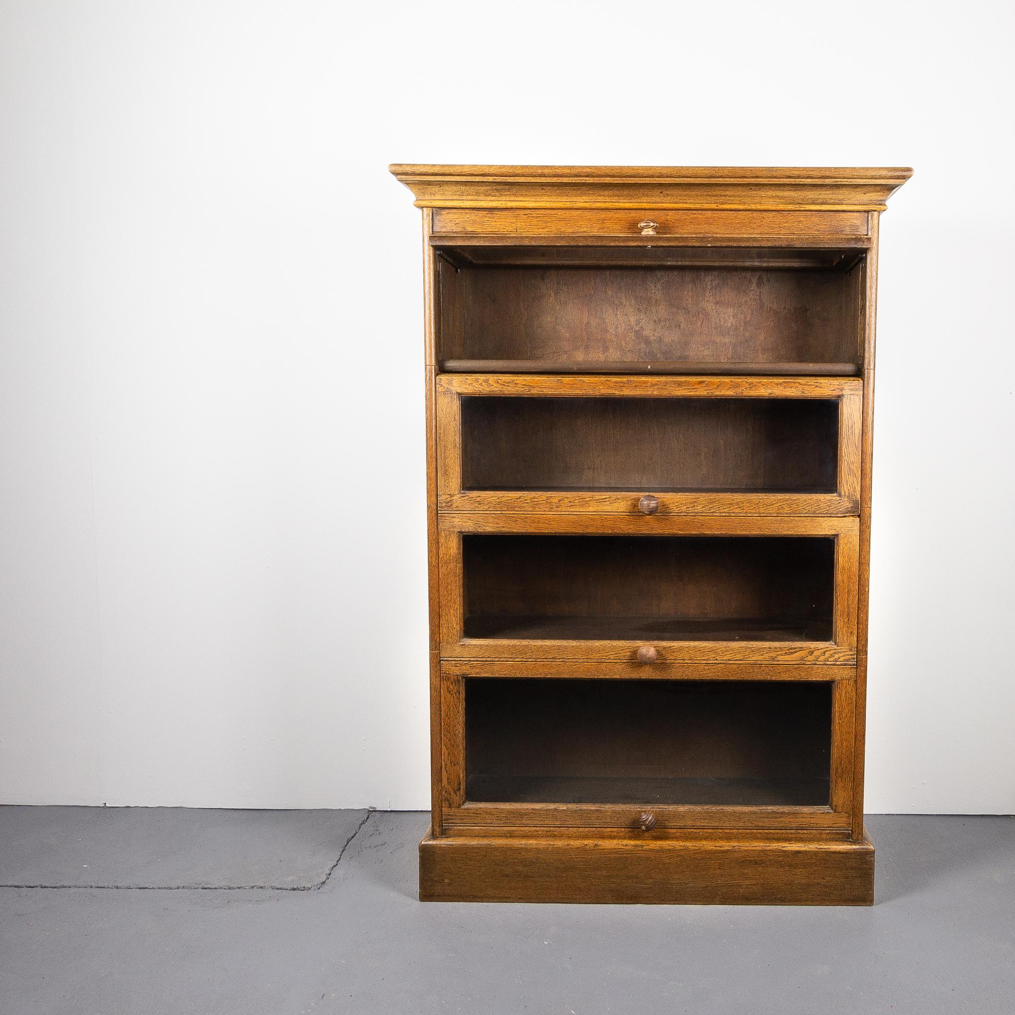 A fine Arts & Crafts style barrister bookcase in solid oak. Beautiful patina to the oak. England, circa 1930s.