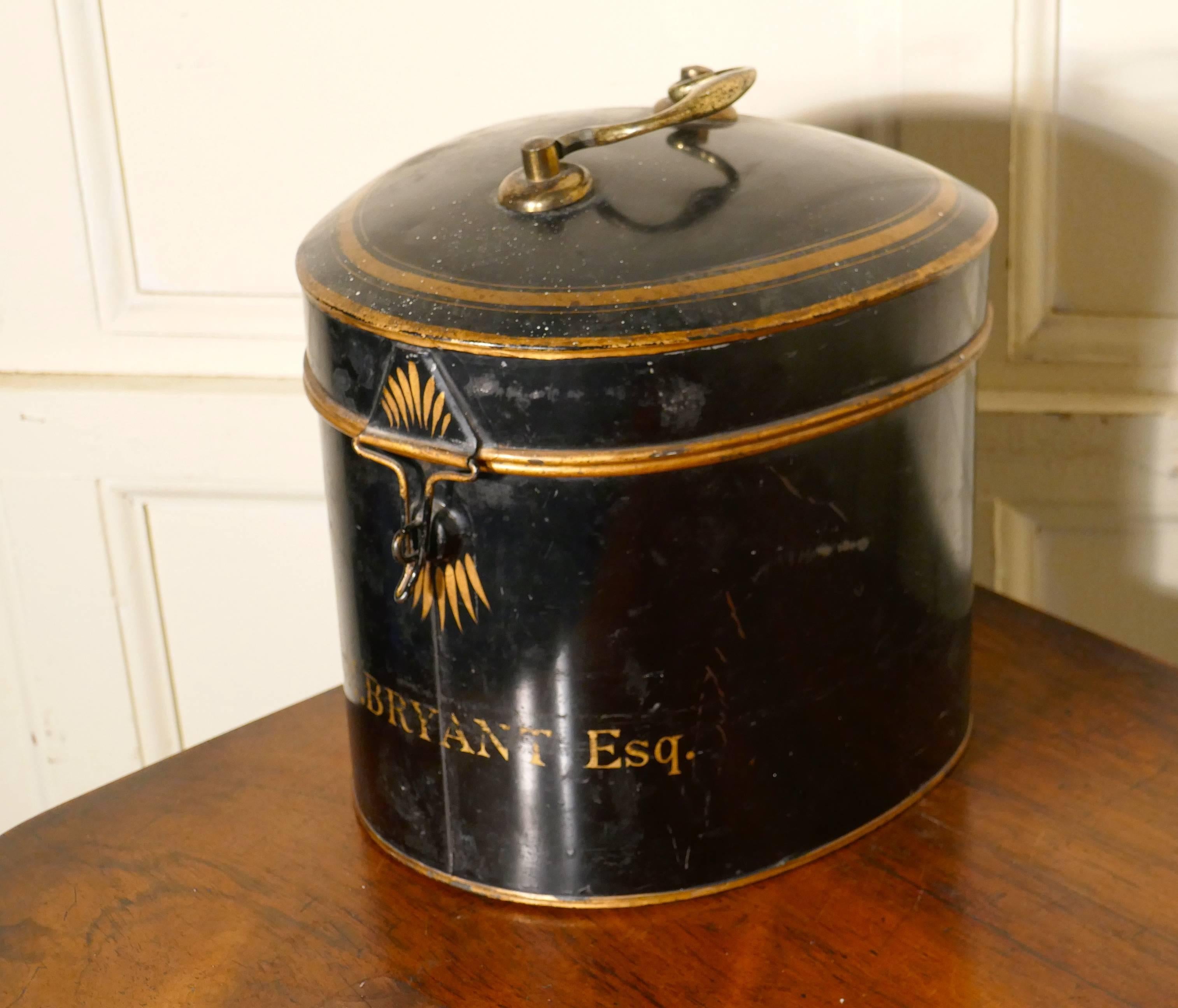 English barrister's bench wig in original tole box with riser by Ravenscroft Law

This interesting piece comes in its original Toleware wig box, which holds the bench wig on its stand, the box is in black japanned steel decorated with gold and