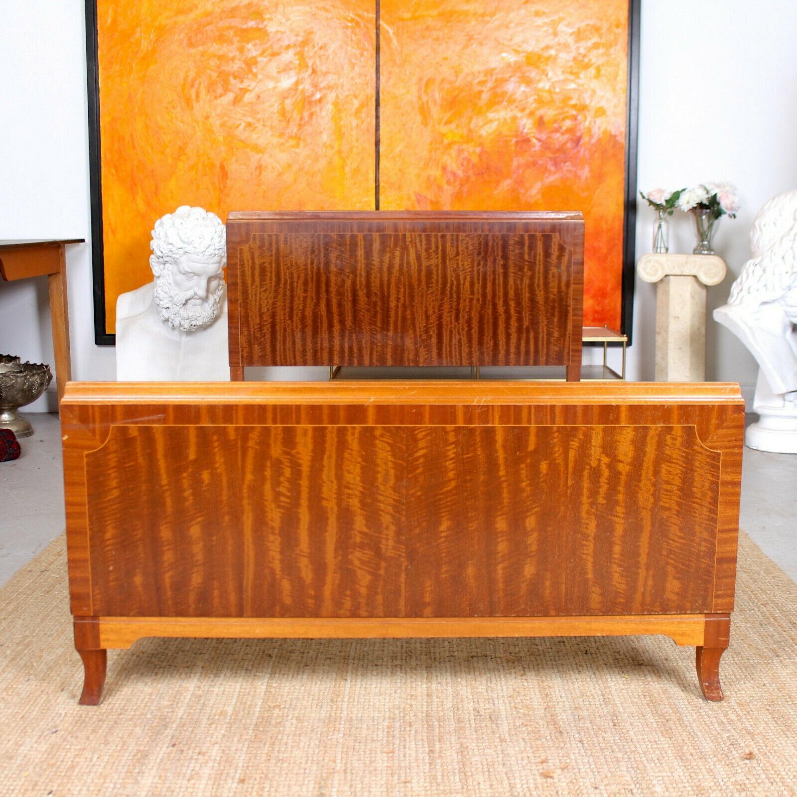 Fine quality inlaid mahogany Marquetry panel bedframe originally retailed by Maple & Co.
England, circa 1950.